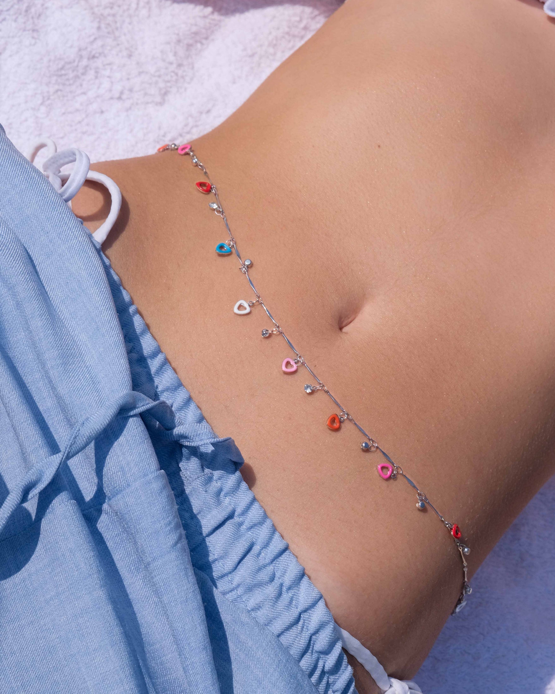 Silver belly chain with heart charms and zirconia stones, ideal as silver waist chain jewelry and summer body jewelry for women.