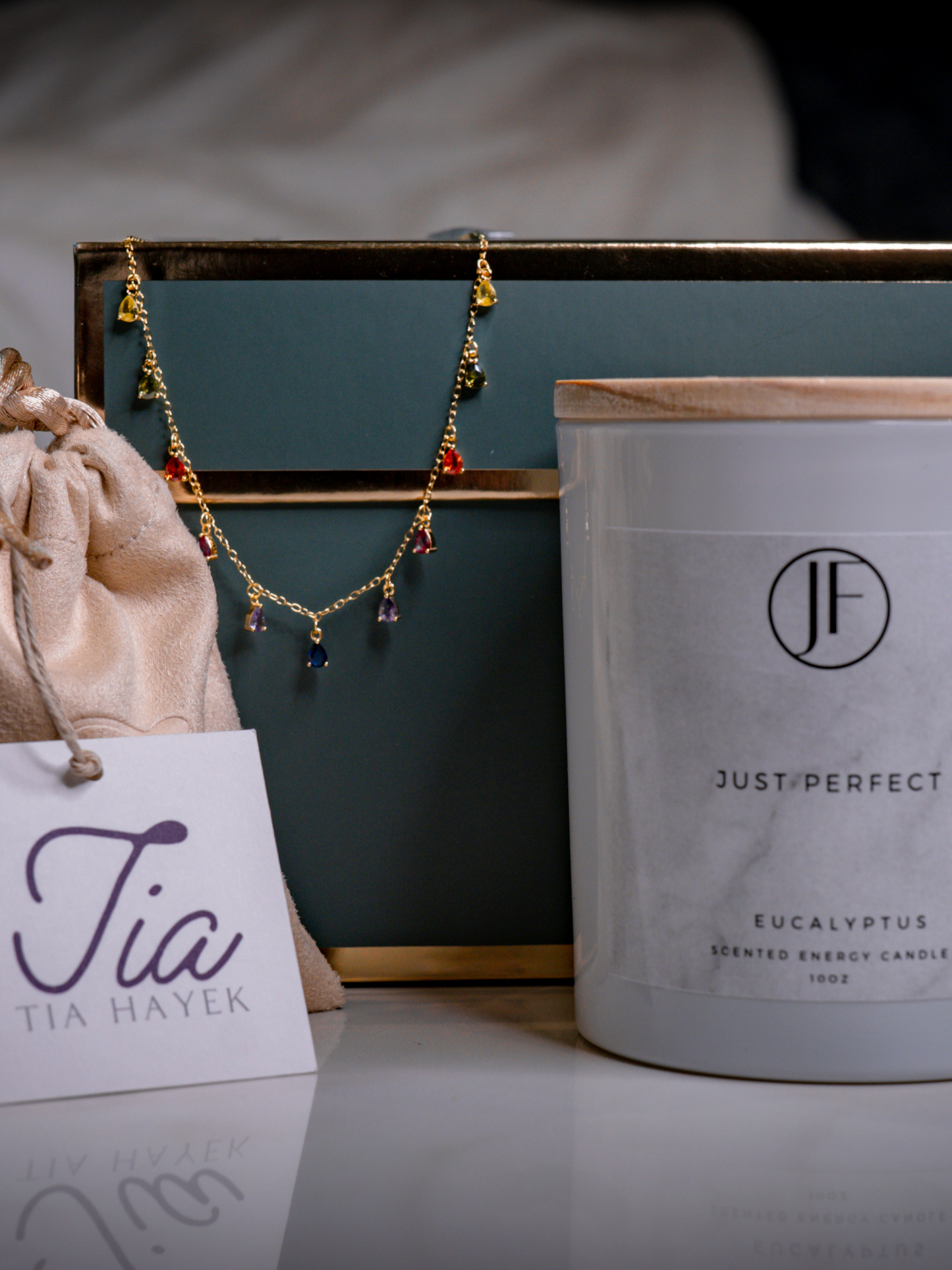 Holiday Gift Box includes a gold-plated sterling silver zirconia stone chain necklace, and a hand-poured soy-wax eucalyptus essential oil scented candle.