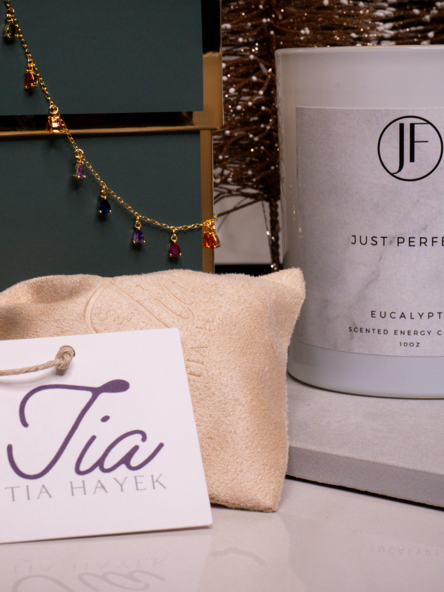 Holiday Gift Box includes a gold-plated sterling silver zirconia stone chain necklace, and a hand-poured soy-wax eucalyptus essential oil scented candle.