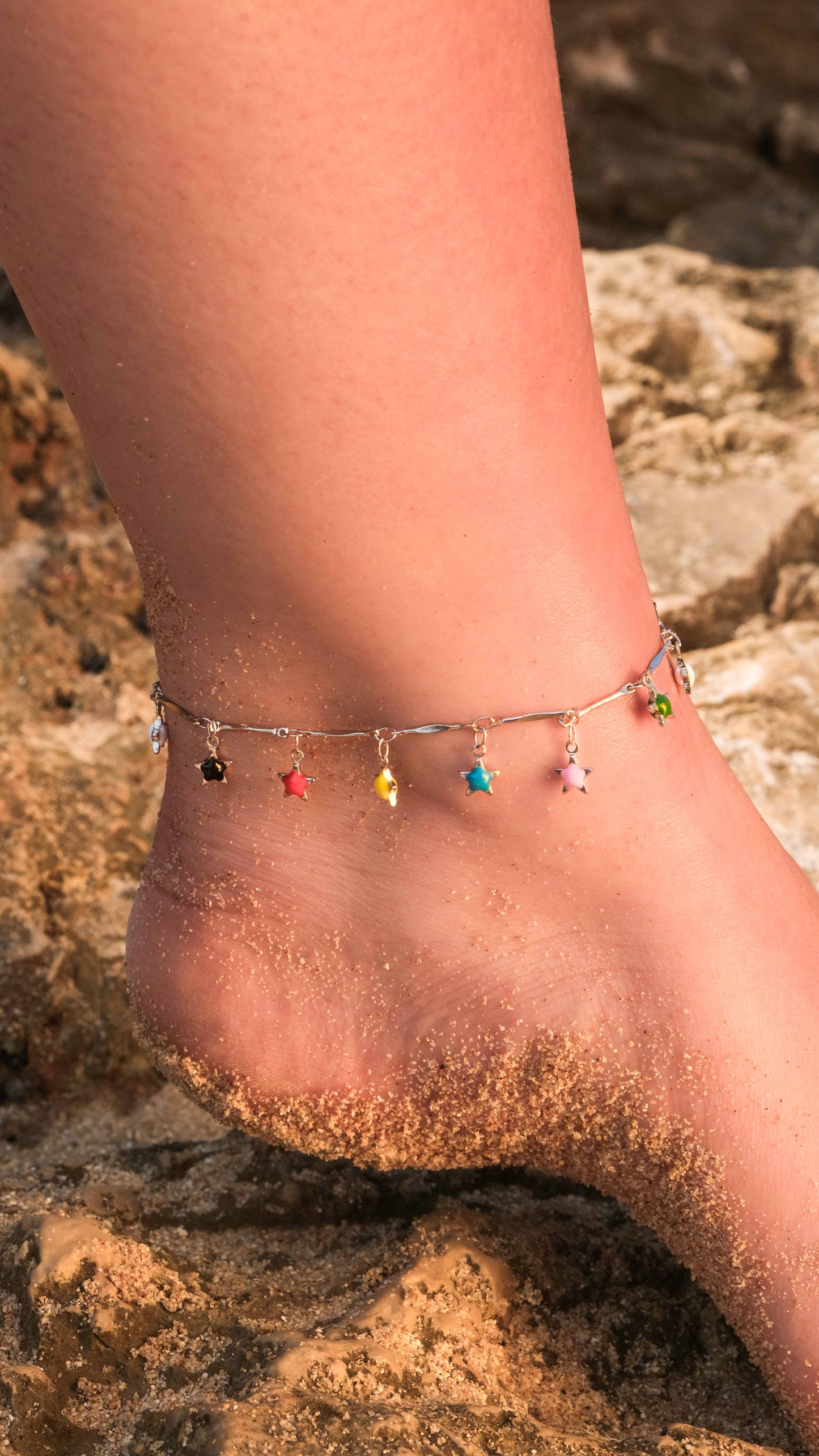 Silver anklet with multicolored star charms, a playful ankle bracelet and silver anklets style inspired by Pandora anklet designs.