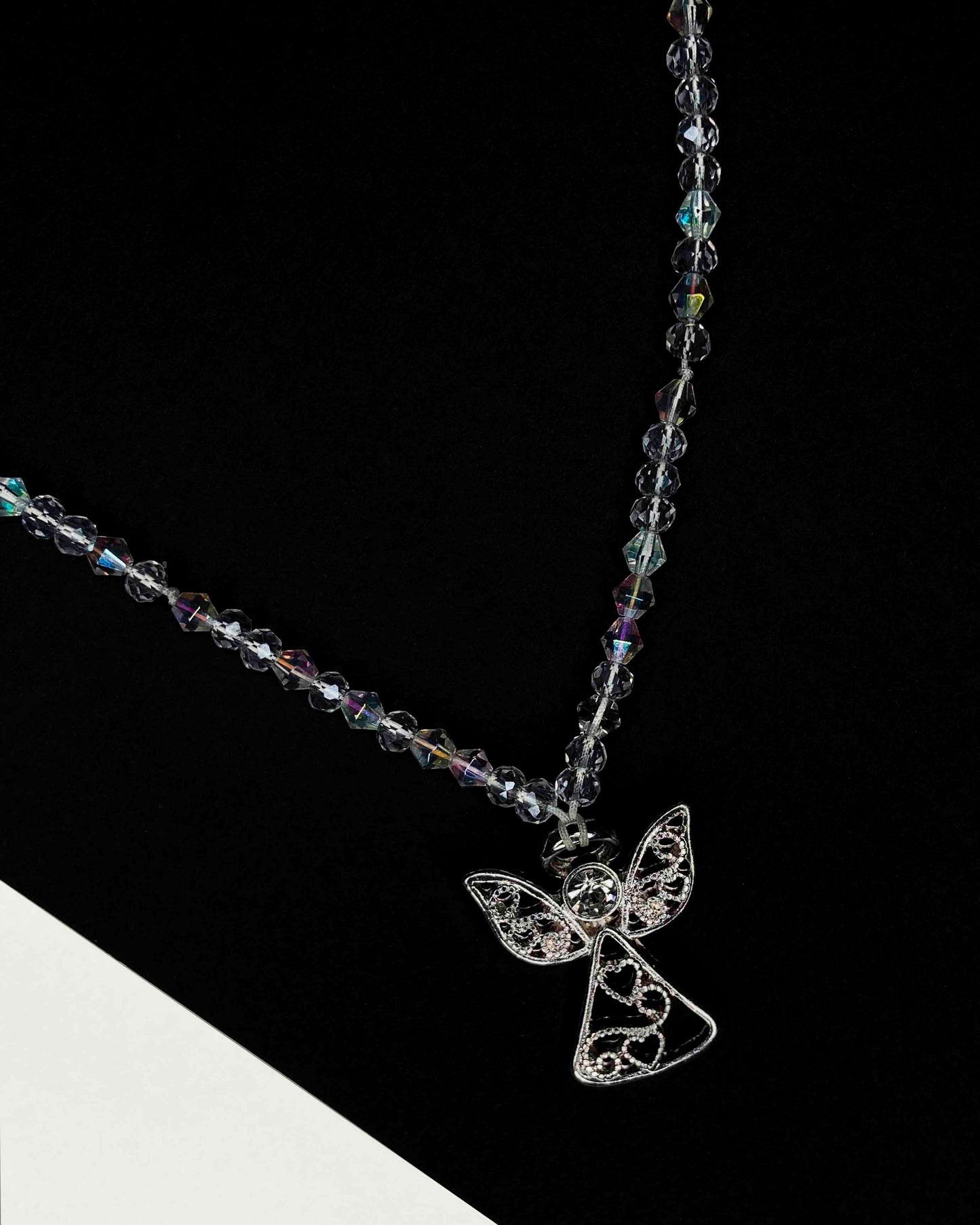 Handmade clear crystal beaded necklace with angel charm.