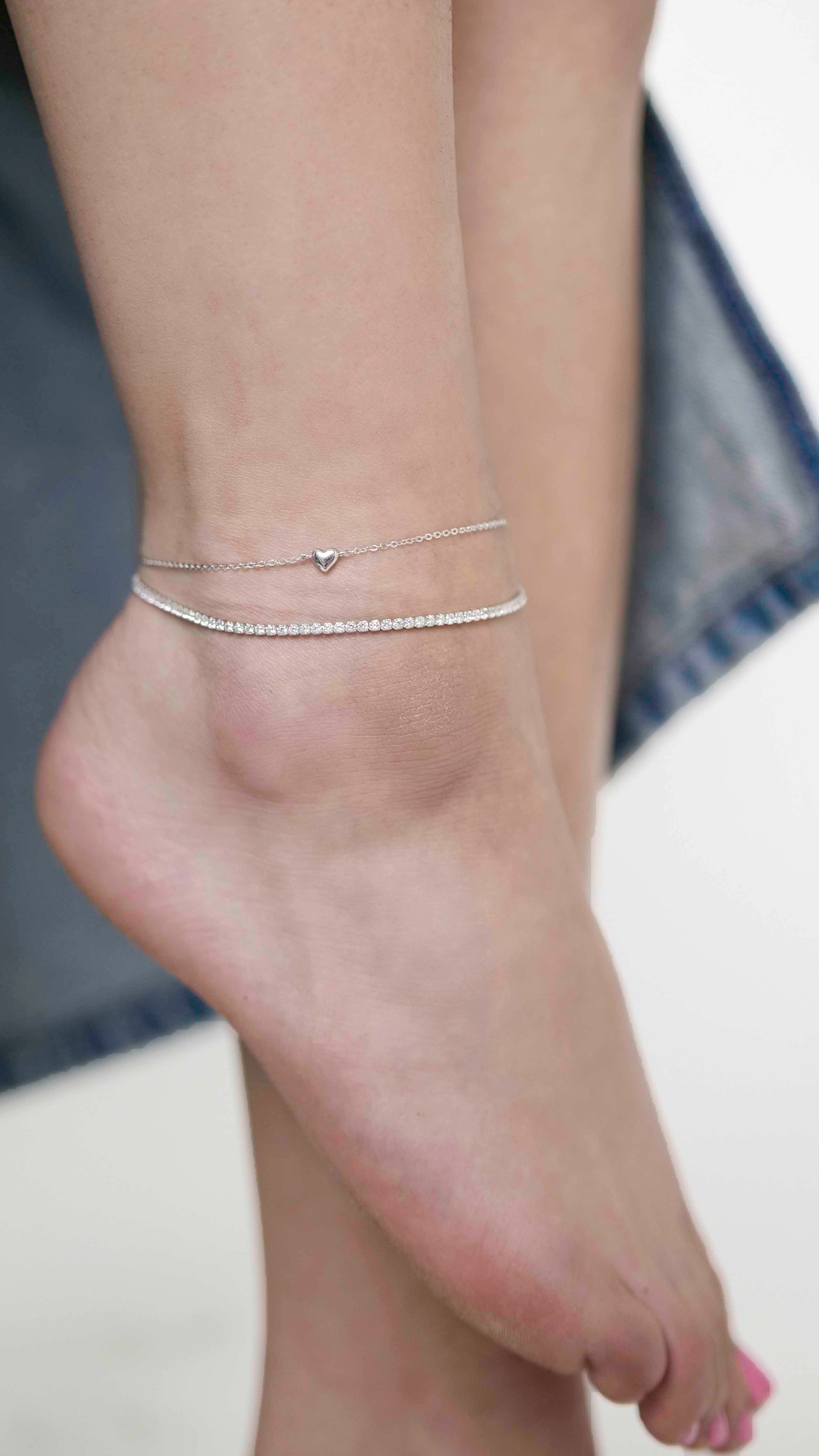 Sterling silver zirconia stone tennis anklet with heart link chain anklet.