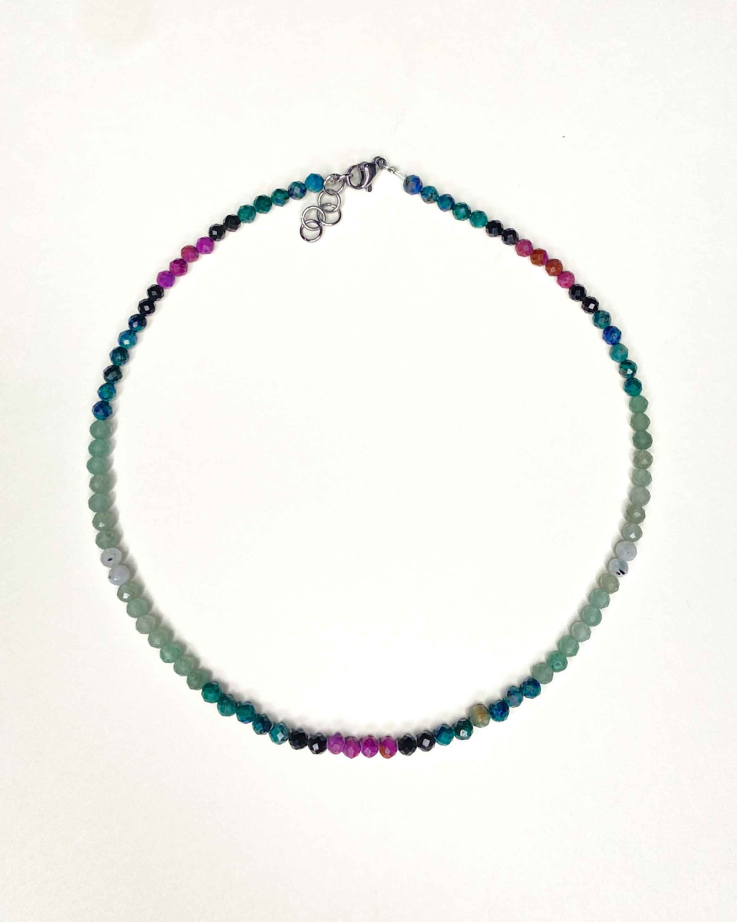 Handmade beaded green and purple mixed gemstone necklace with a sterling silver clasp.