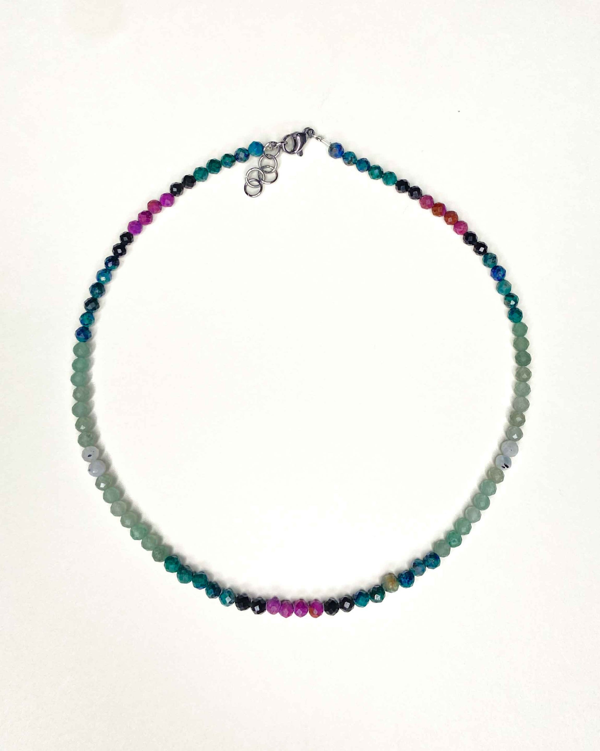 Handmade beaded green and purple mixed gemstone necklace with a sterling silver clasp.