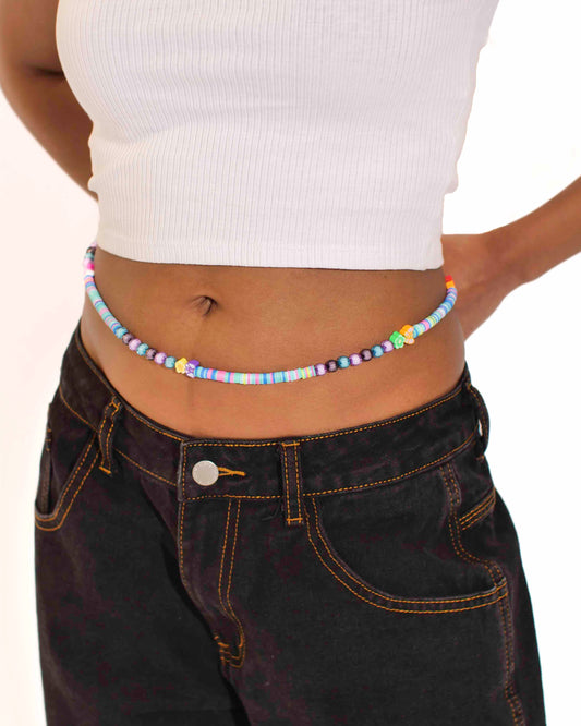 Handmade beaded belly chain made using multicolor flat rubber beads, flower and butterfly charms, and Discoball-like beads.
