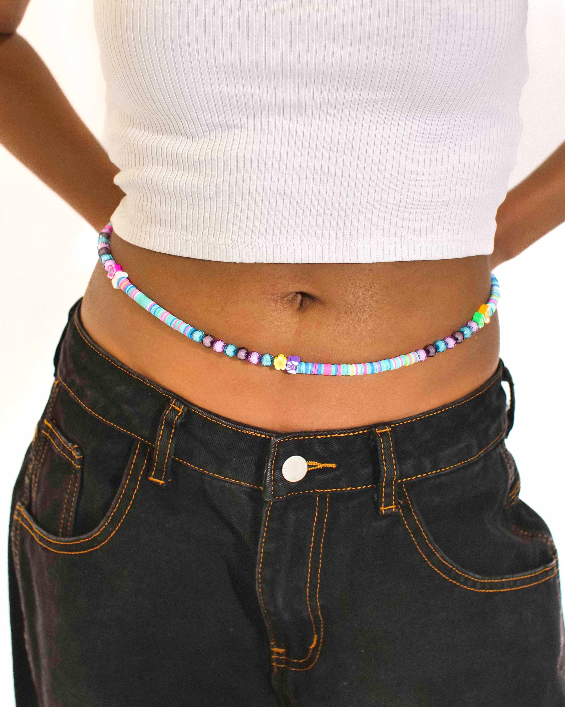 Handmade beaded belly chain made using multicolor flat rubber beads, flower and butterfly charms, and Discoball-like beads.