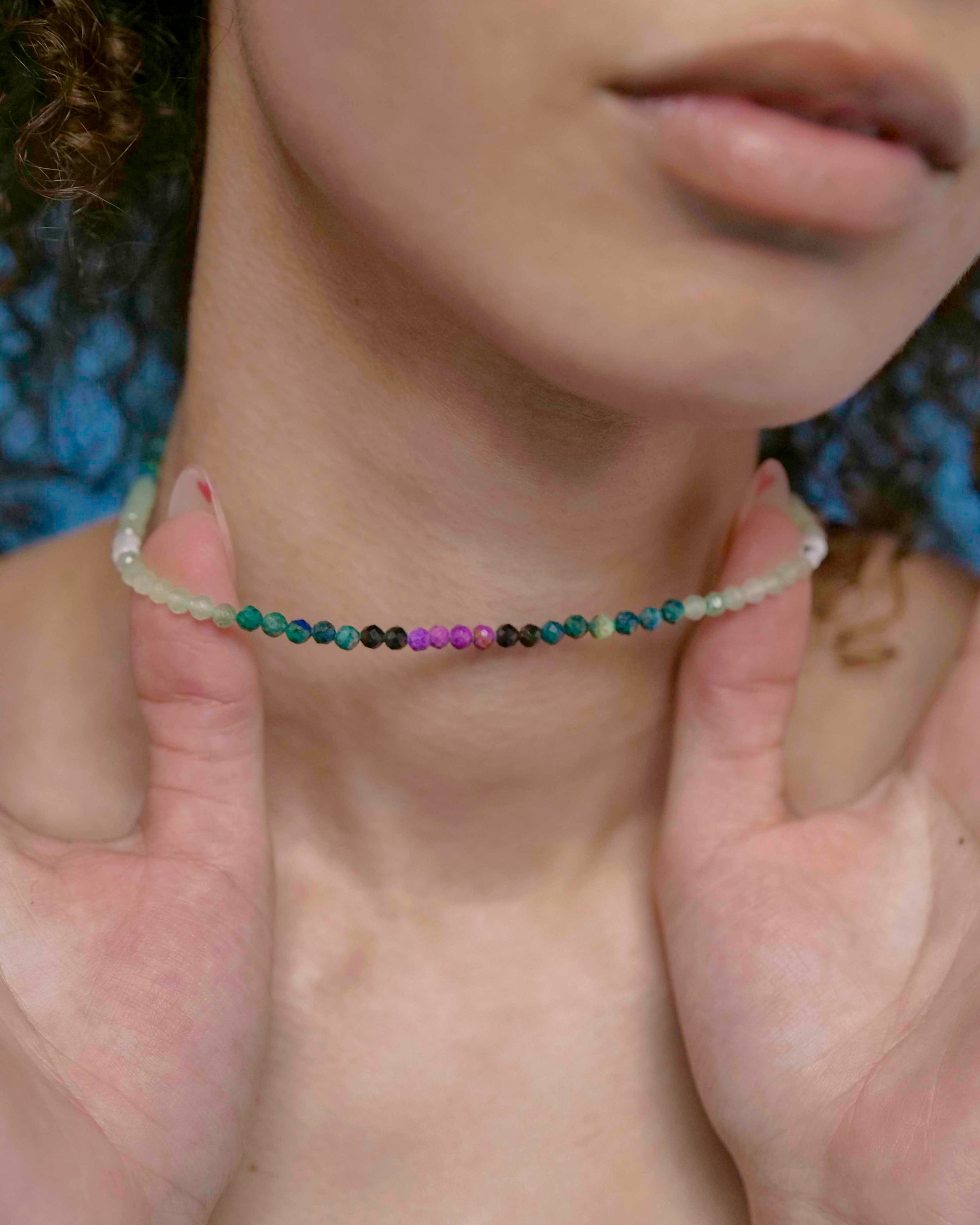 Handmade beaded green and purple mixed gemstone necklace with a sterling silver clasp.
