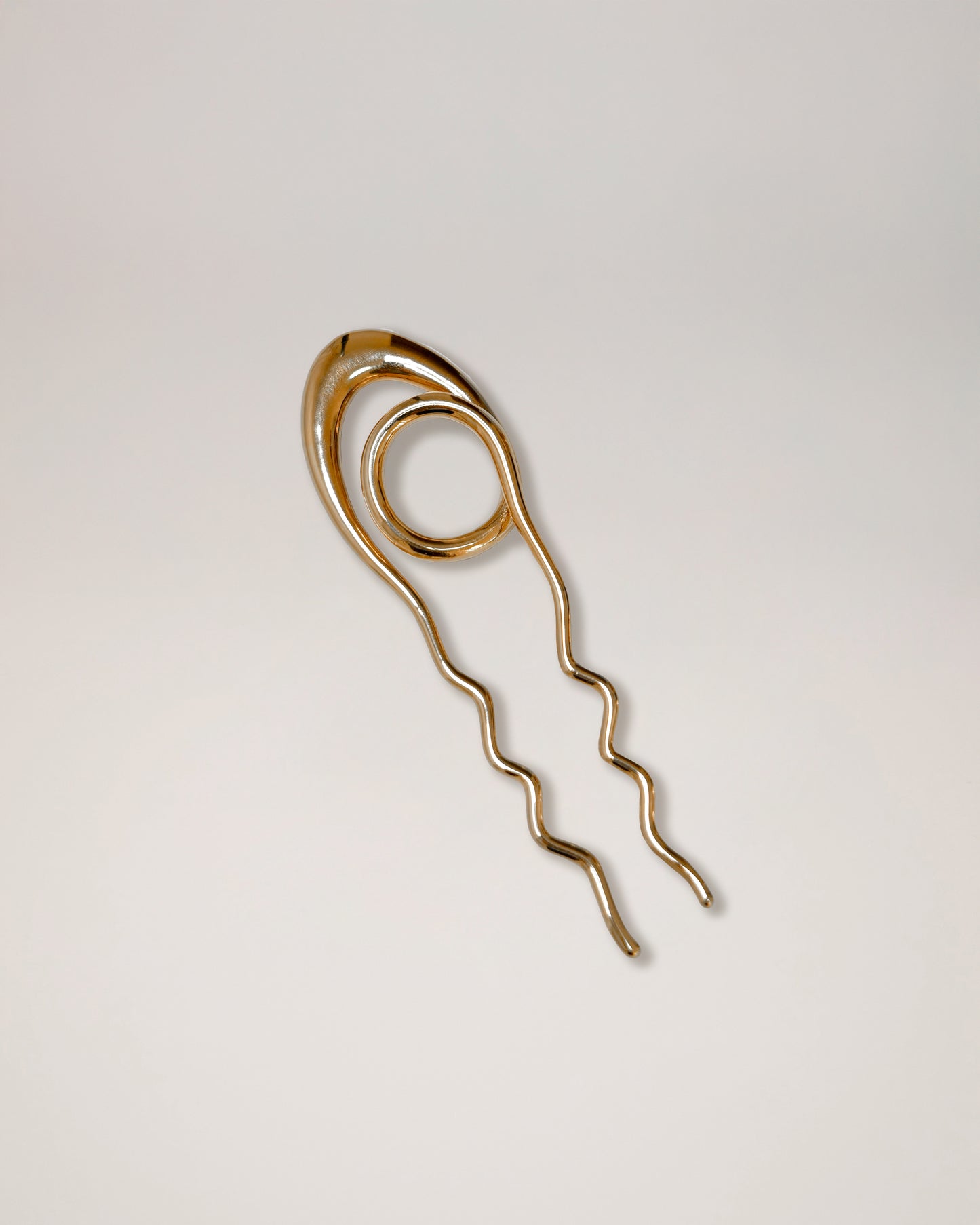 Sleek geometric hairpin styled in minimalist look, contemporary jewelry hair accessory