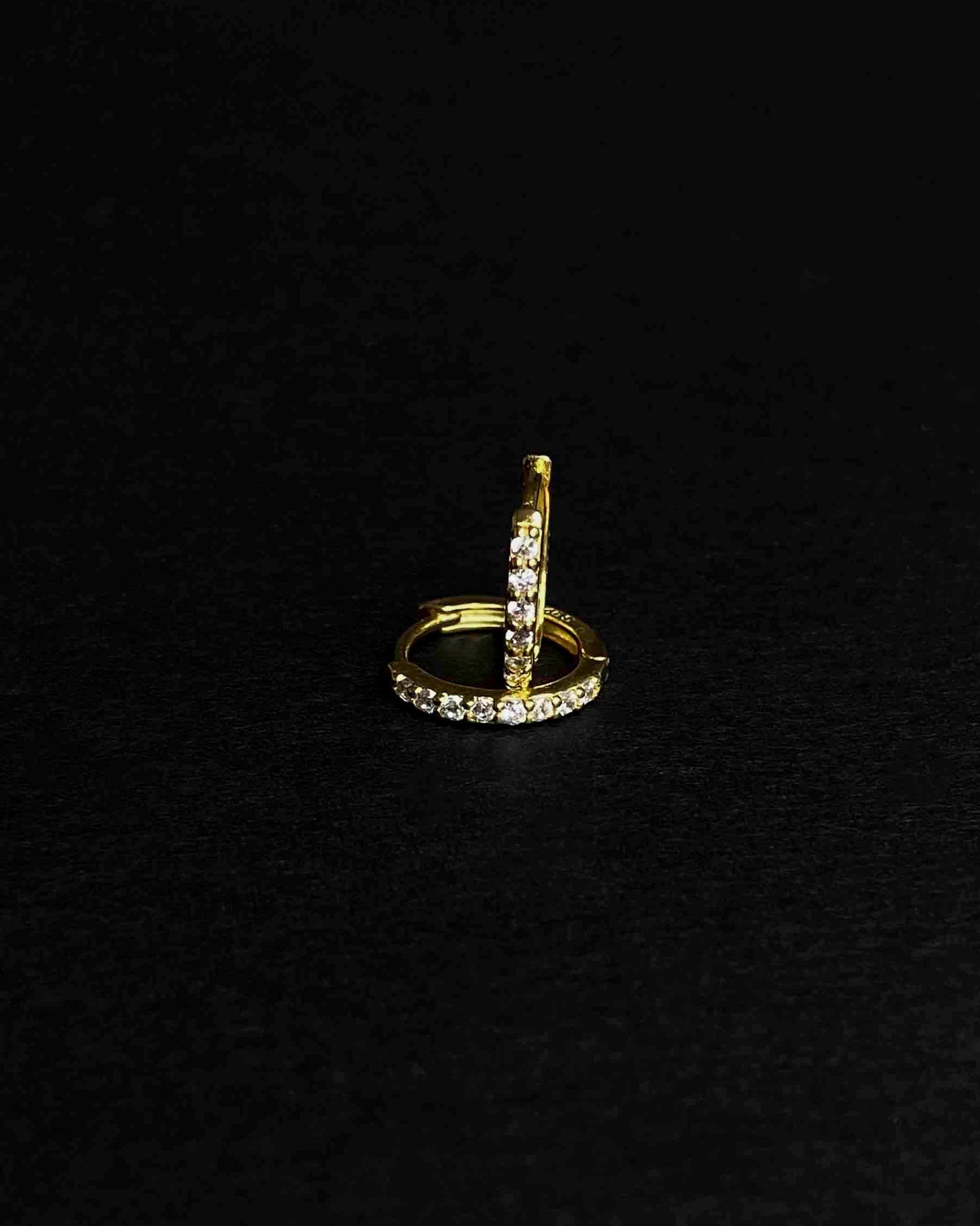 Gold-plated hoop earrings with zirconia stones.