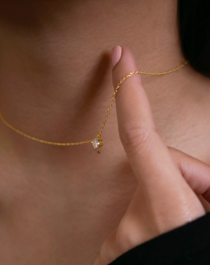 Gold-plated chain link necklace with zirconia stones.