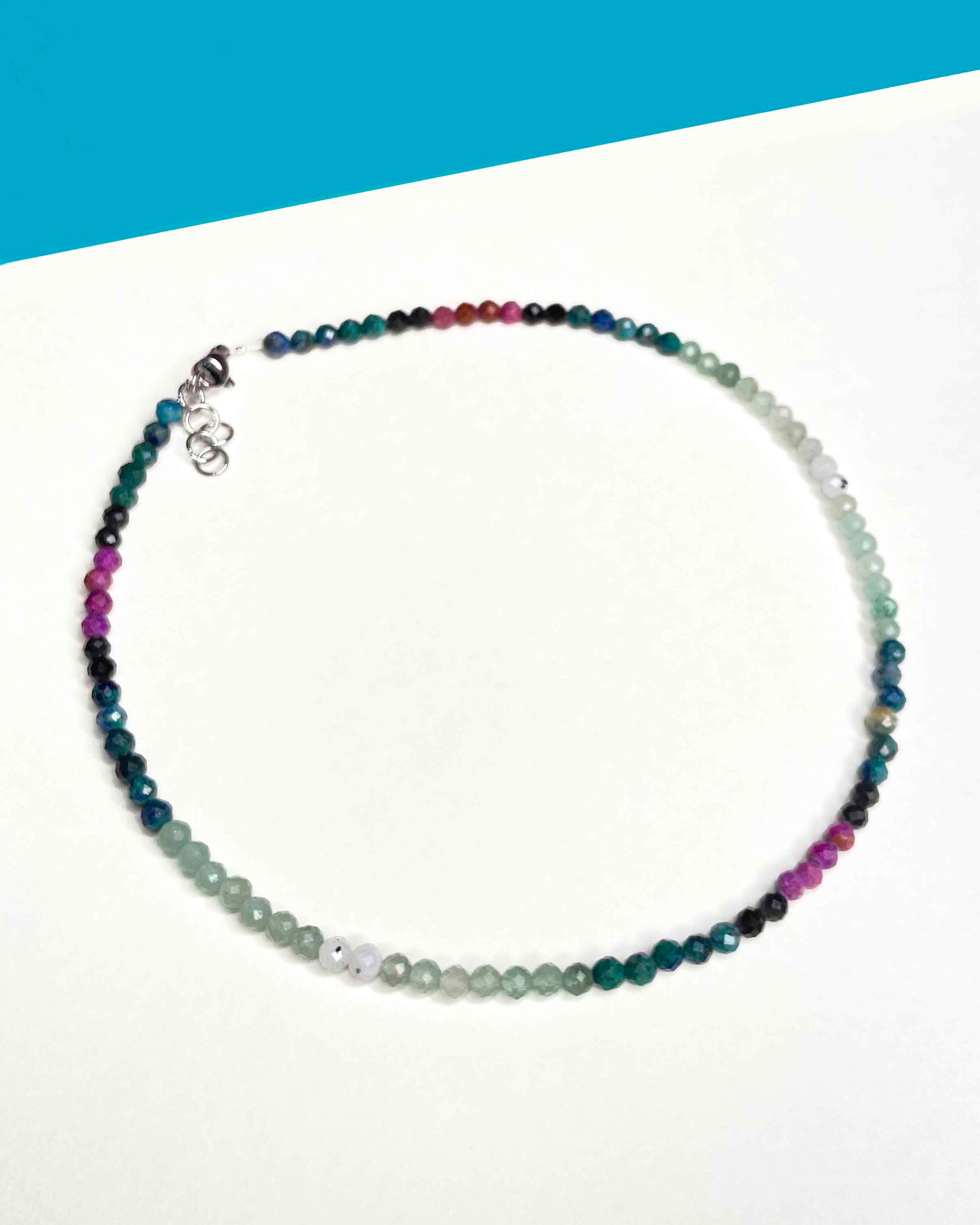 Handmade beaded green and purple mixed gemstone necklace with a sterling silver clasp.