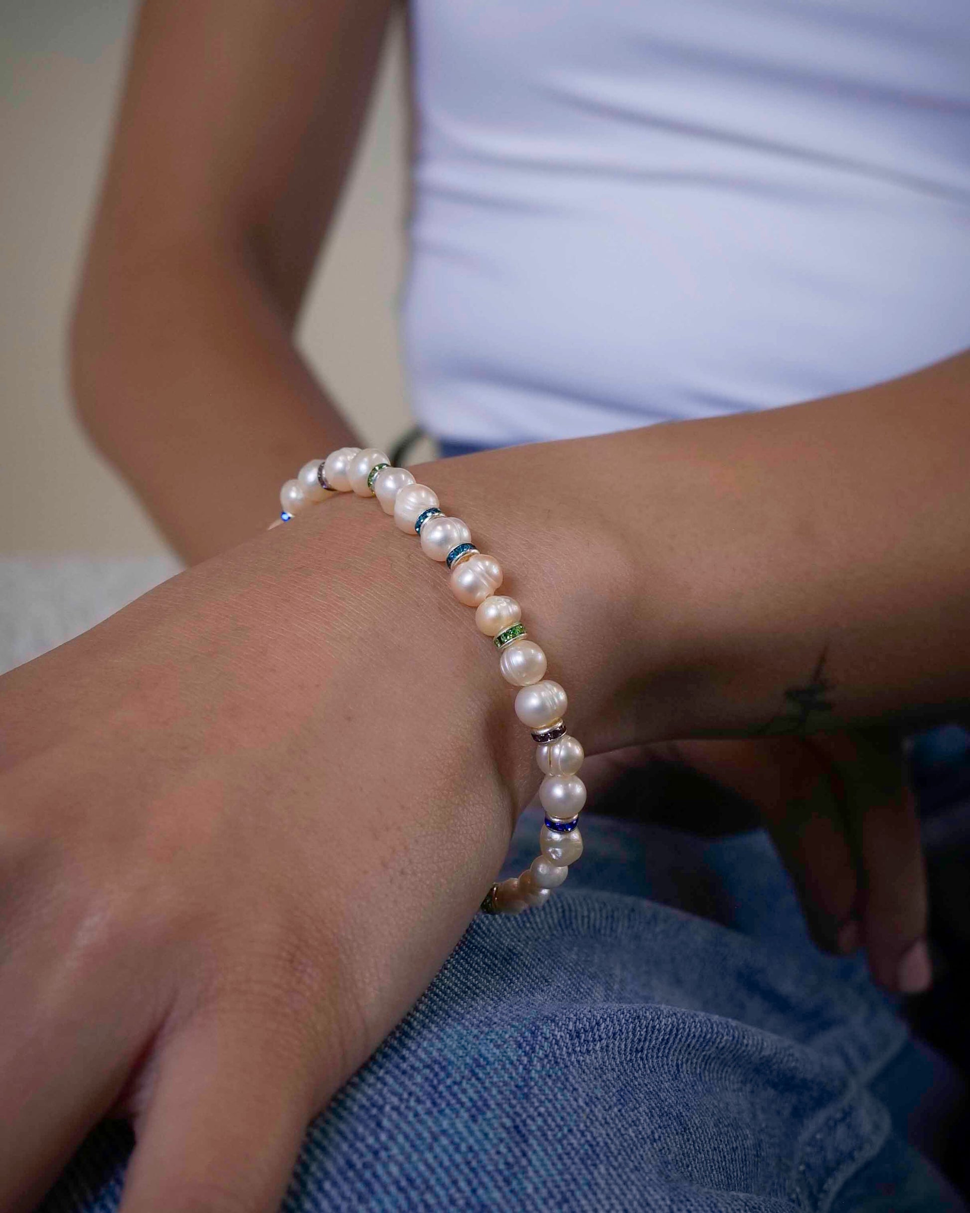 Handmade beaded pearl bracelet with rhinestone spacers.