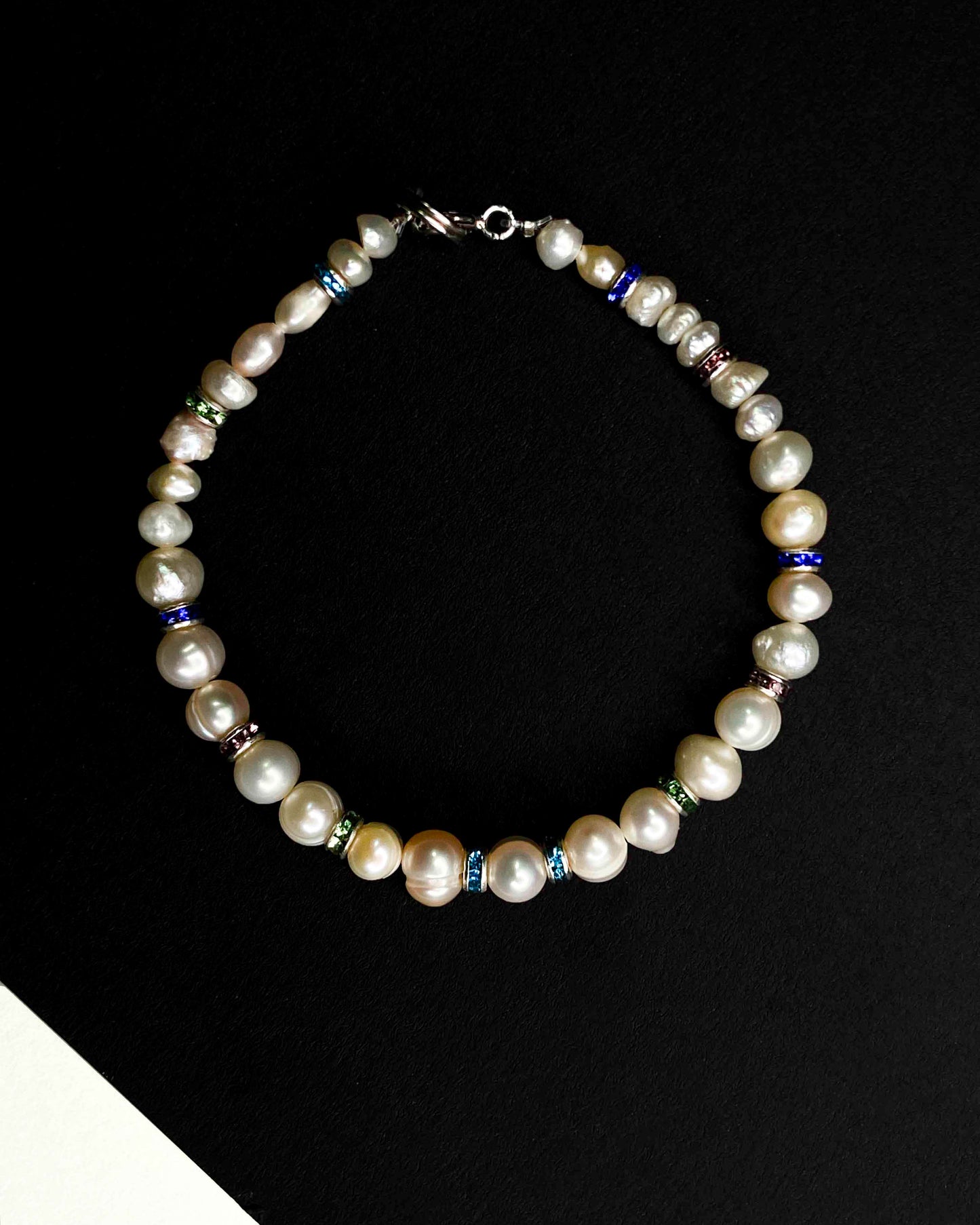 Handmade beaded pearl bracelet with rhinestone spacers.