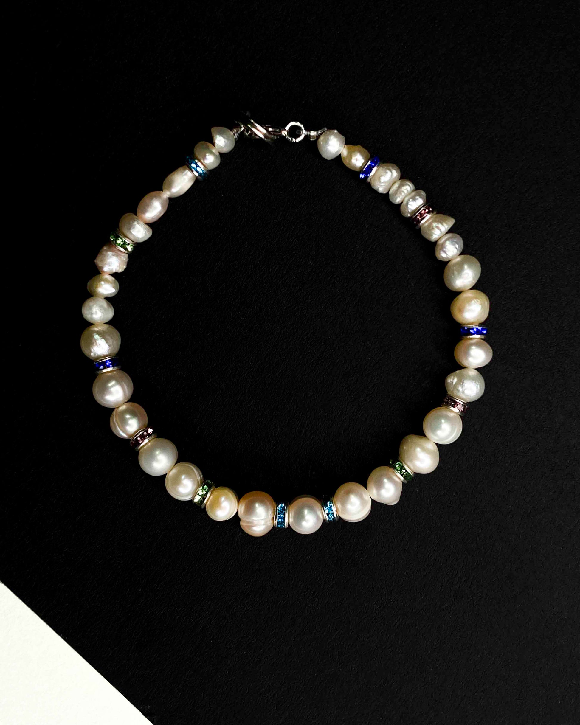Handmade beaded pearl bracelet with rhinestone spacers.