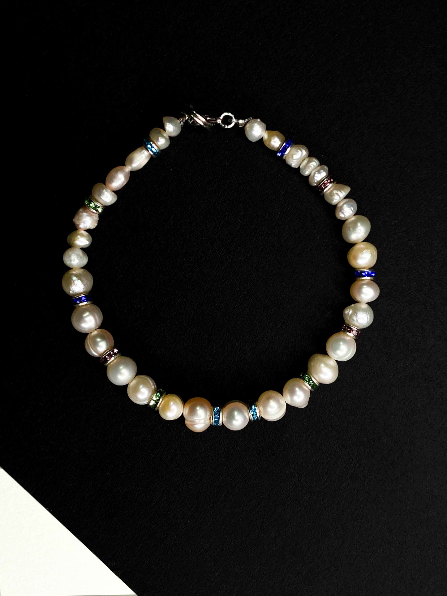 Handmade beaded pearl bracelet with rhinestone spacers. 