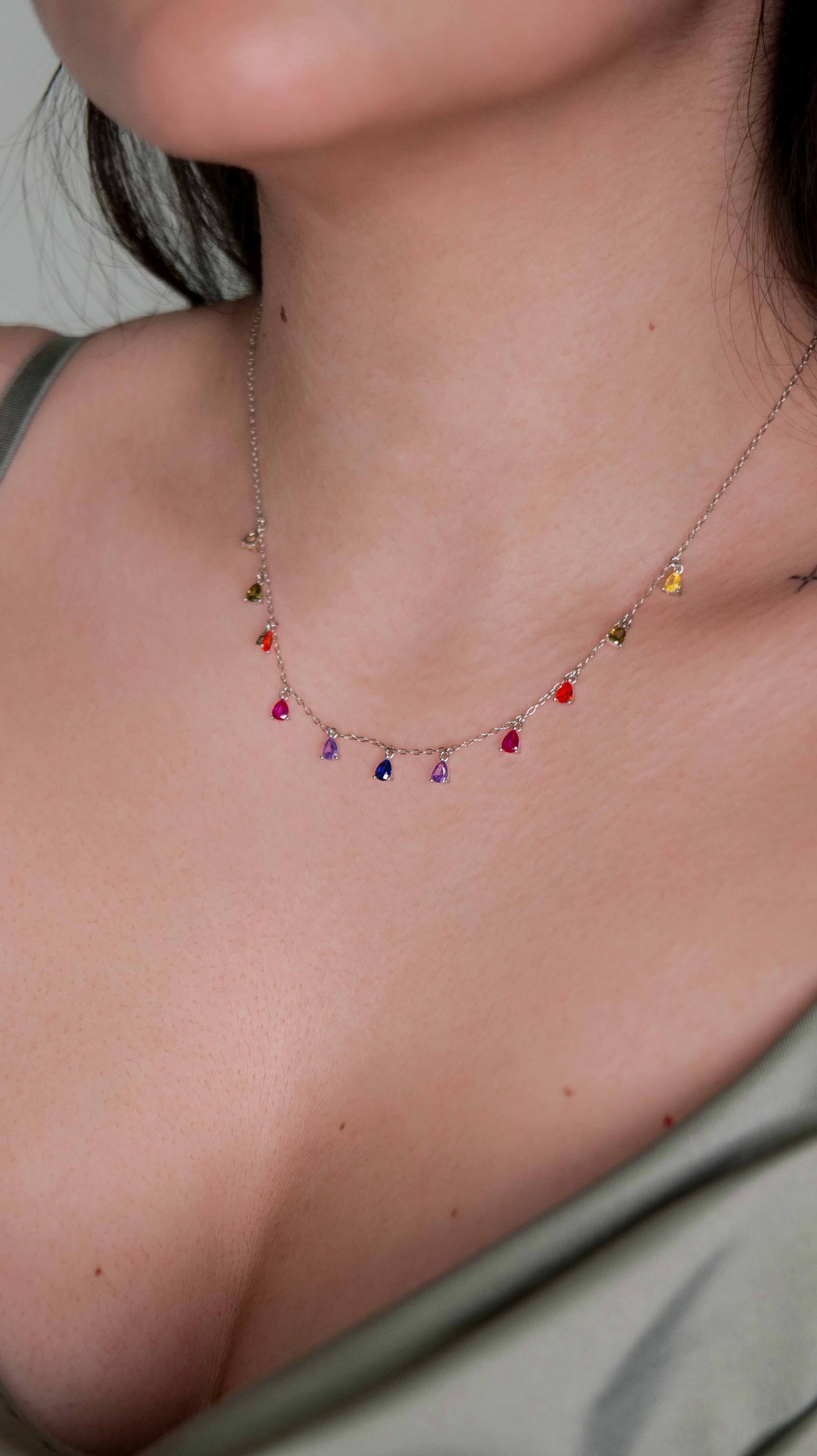 925 sterling silver chain necklace with multicolored zirconia stones.