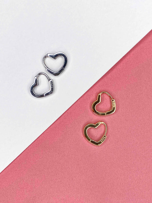 925 sterling silver and gold-plated sterling silver heart hoop earrings.