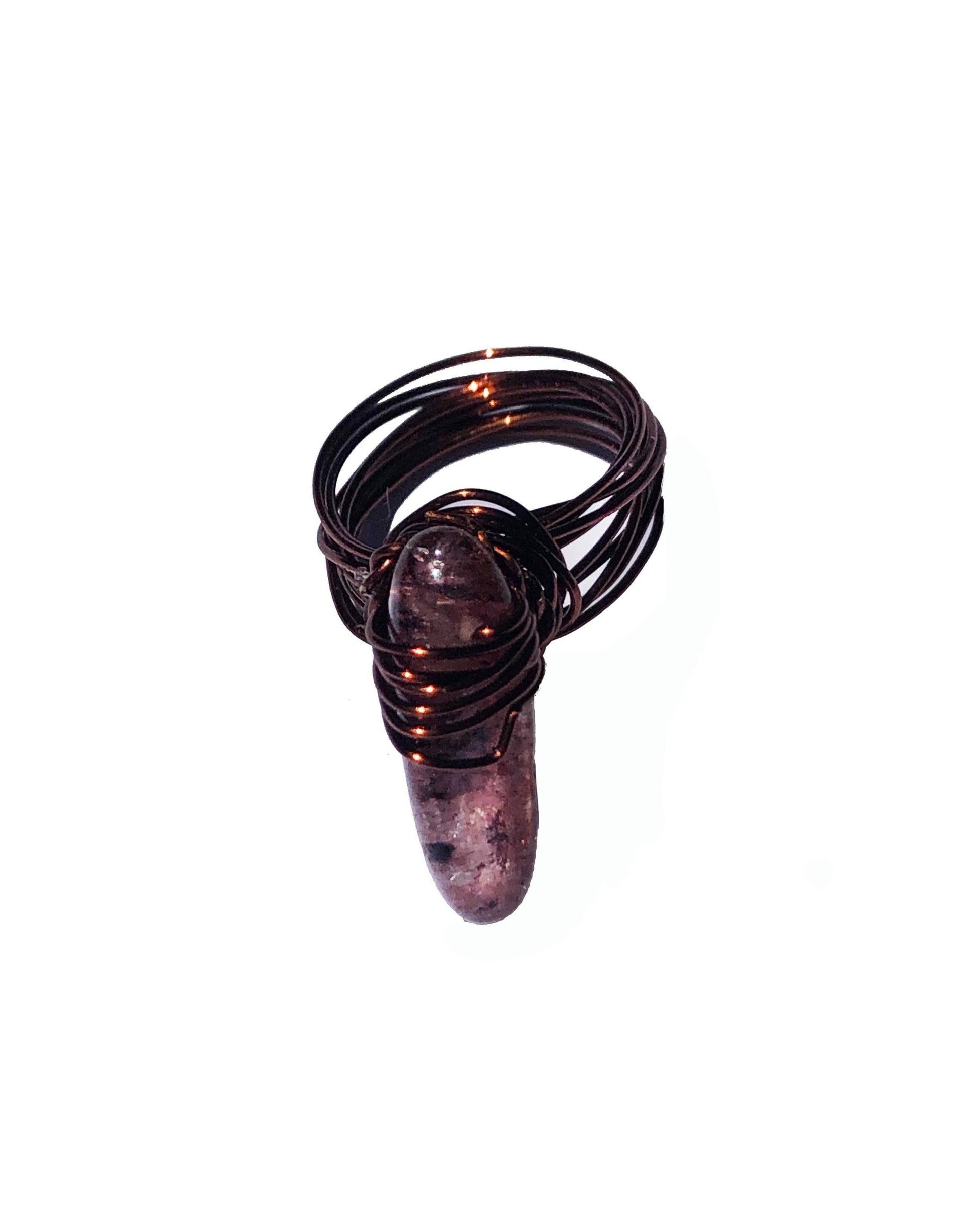 handcrafted wire wrapped ring made using brown wires and a tourmaline gemstone