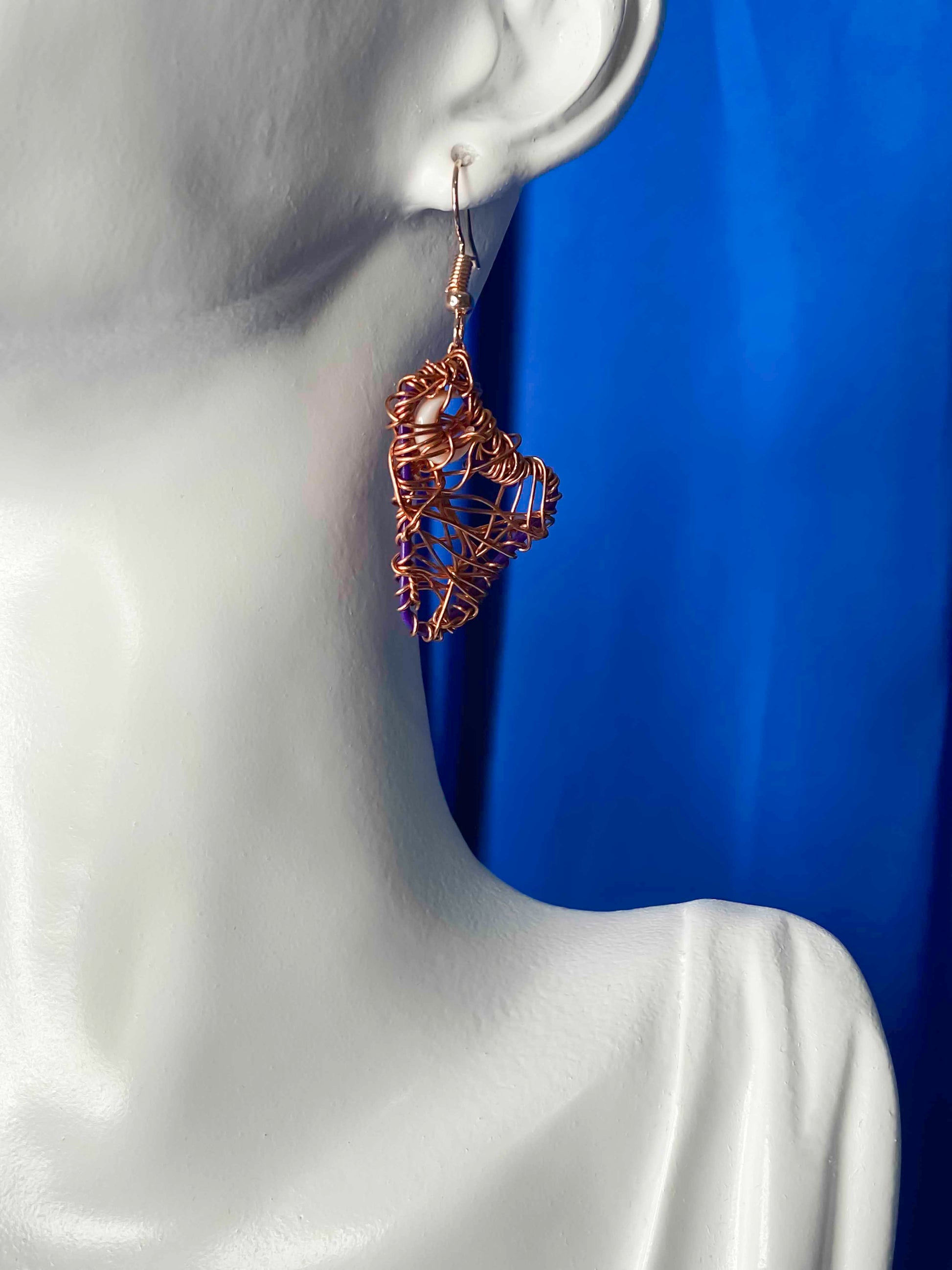 handmade copper wire wrapped crescent moon earrings.