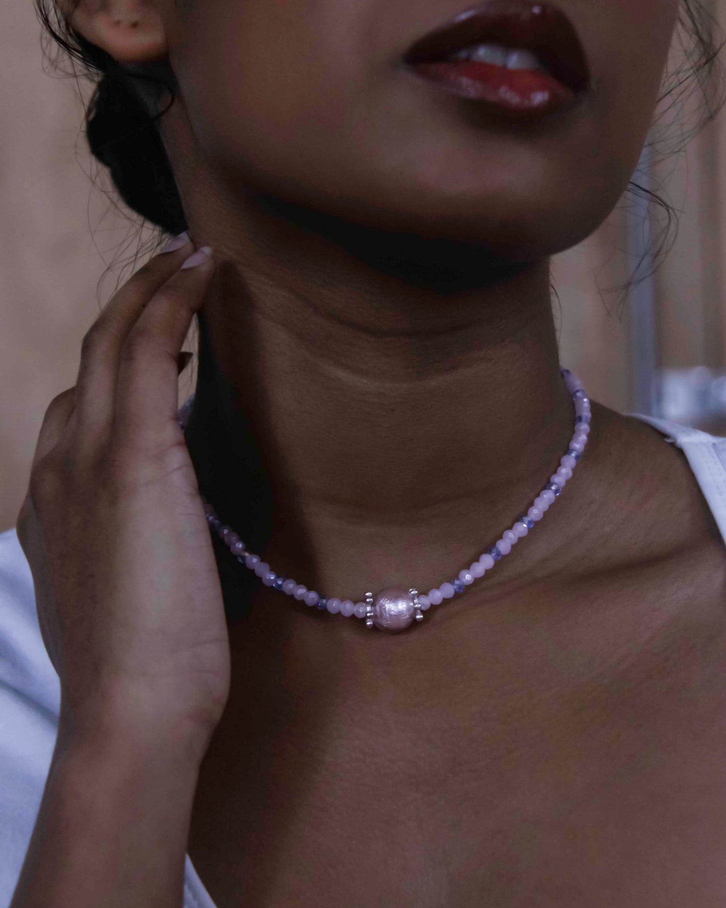 handcrafted pink and blue crystal beaded necklace with paper mache charm.