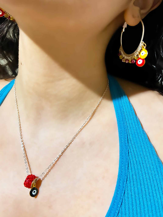 Handmade red and yellow evil eye charm and crystal beaded silver hoops.