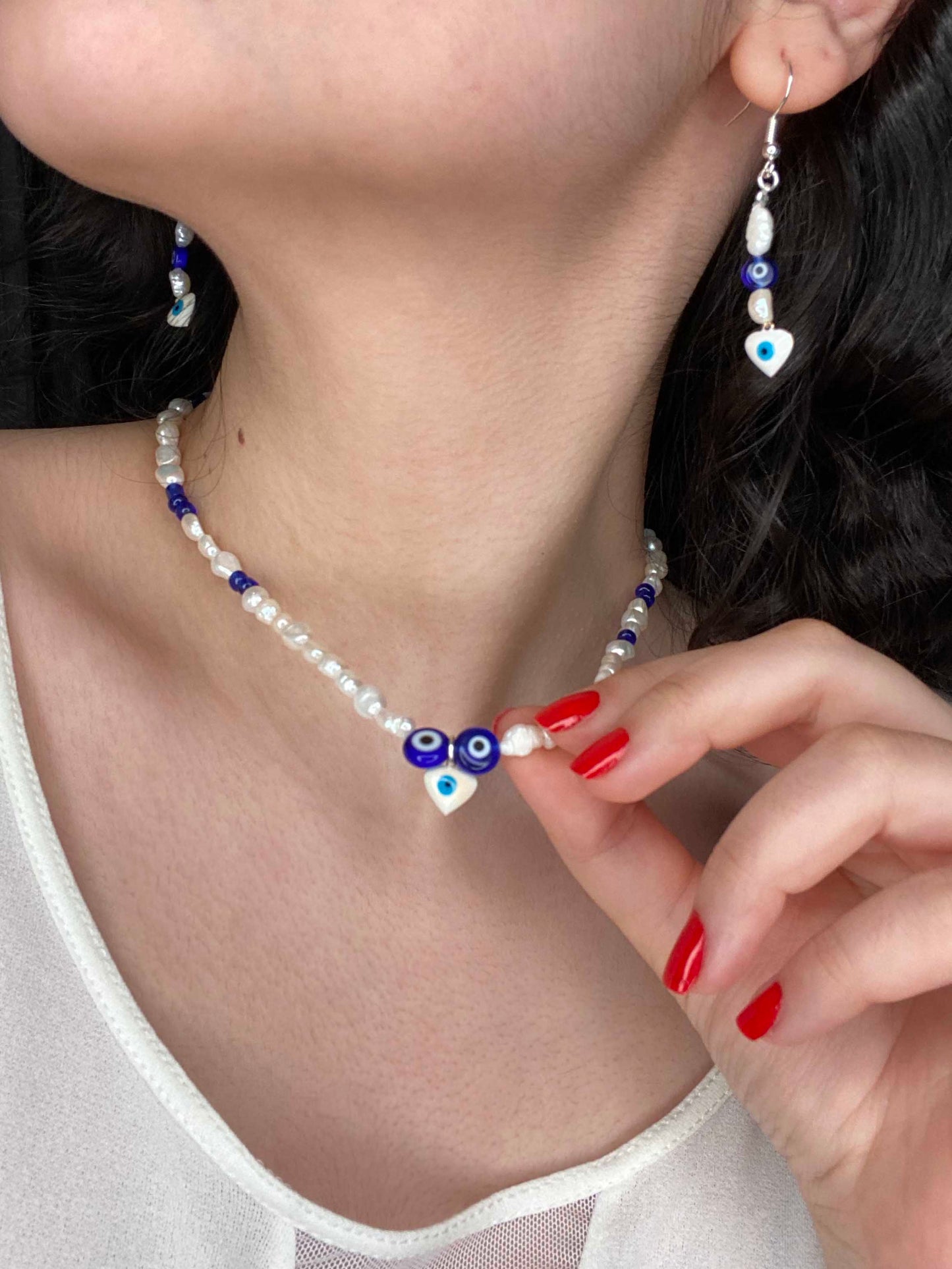 Handmade freshwater pearl & glass beaded necklace, and earrings set made with a blue nazar amulet, and white evil eye charm.