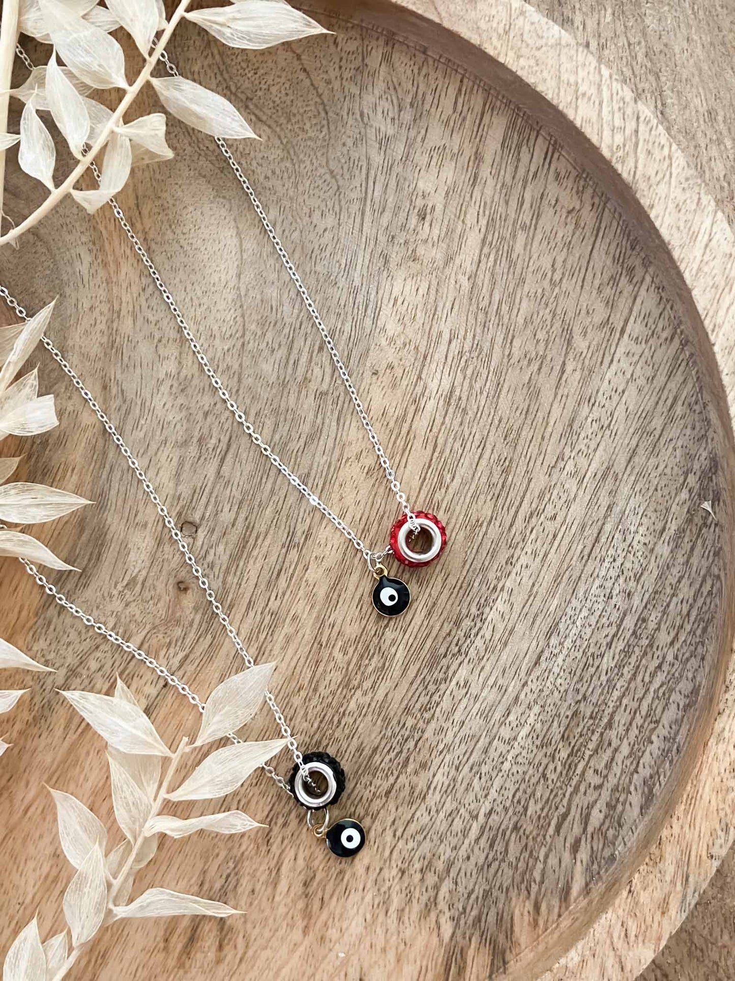 Handmade black evil eye & black rhinestone charm pendant necklace.