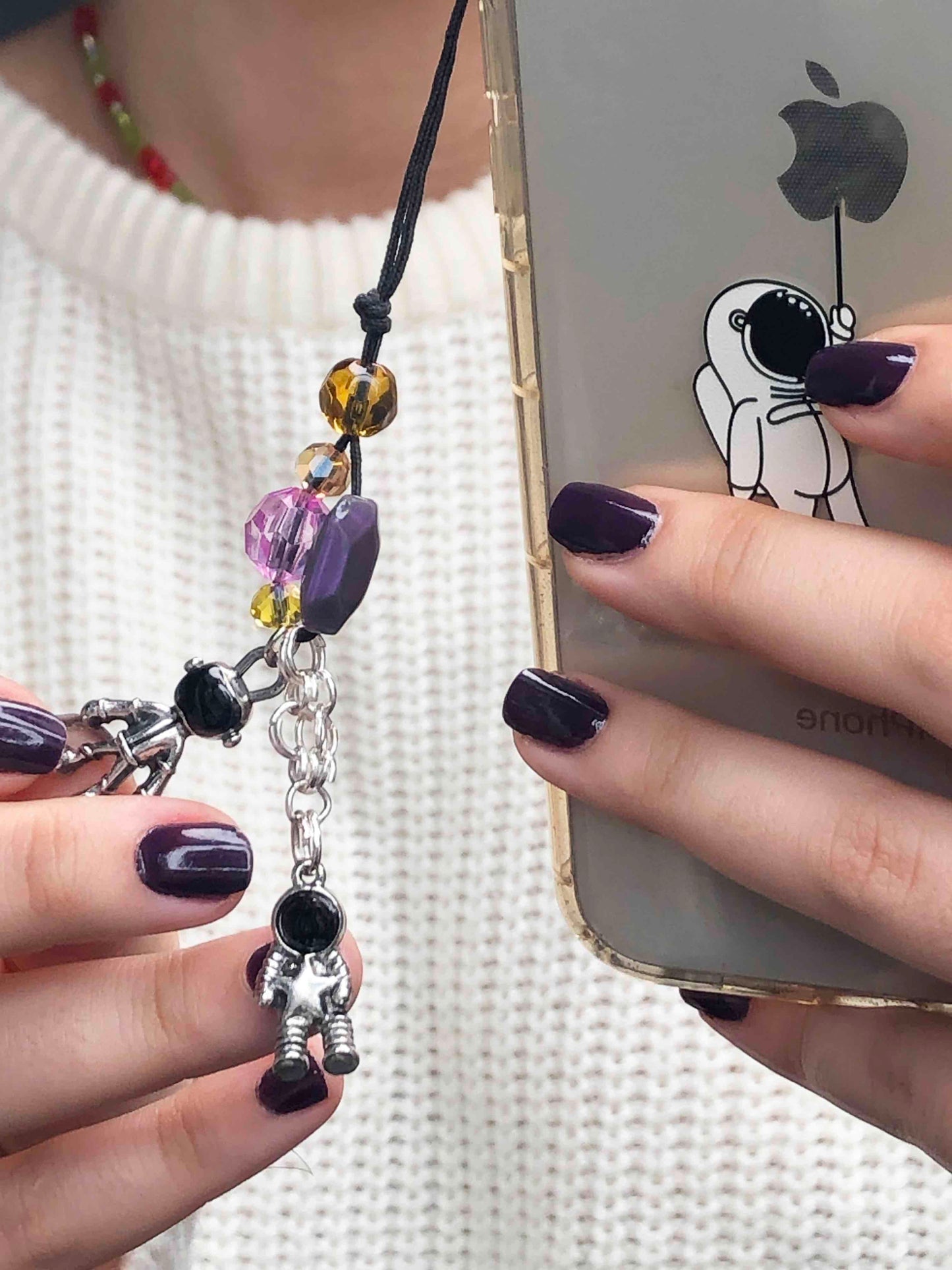 Handmade crystal and glass beaded phone charm with two astronaut charms.