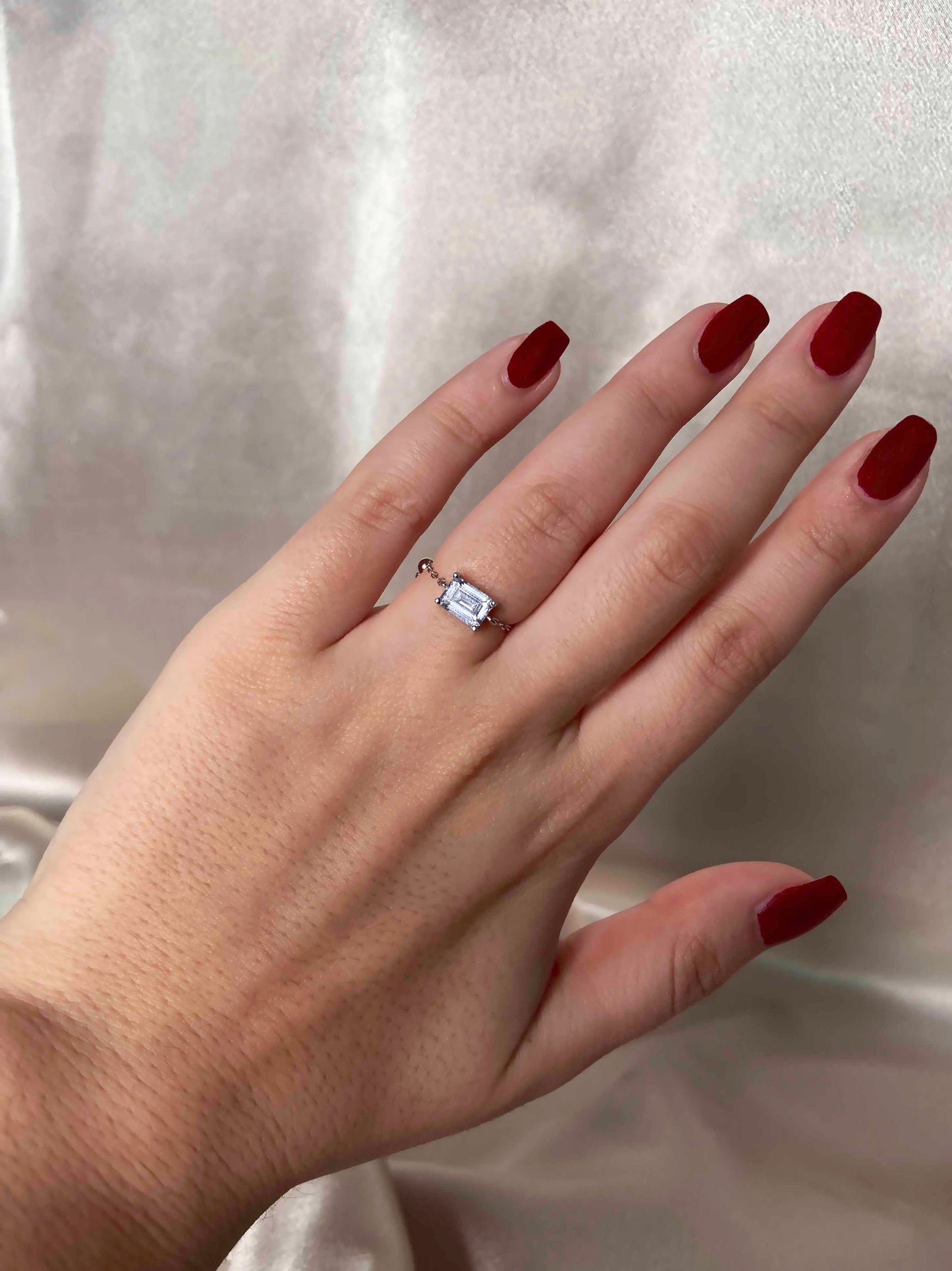 Handcrafted adjustable 925 sterling silver rectangle cubic zirconia ring.