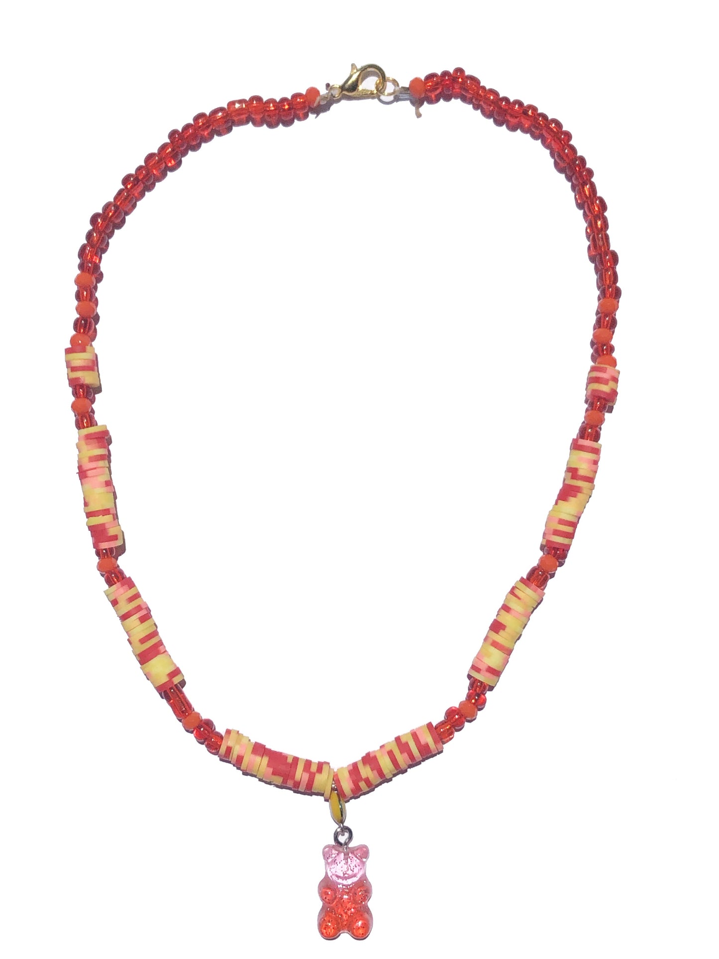 handcrafted necklace beaded using red, orange, yellow and pink glass and flat rubber beads. Accompanied by a yellow evil eye, and pink and orange gummy bear-like charm.