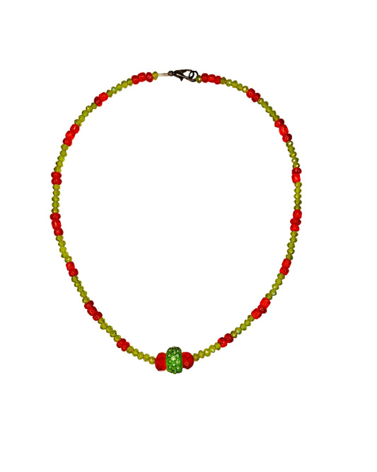 Handcrafted red and green crystal beaded necklace with rhinestone charm at its center.