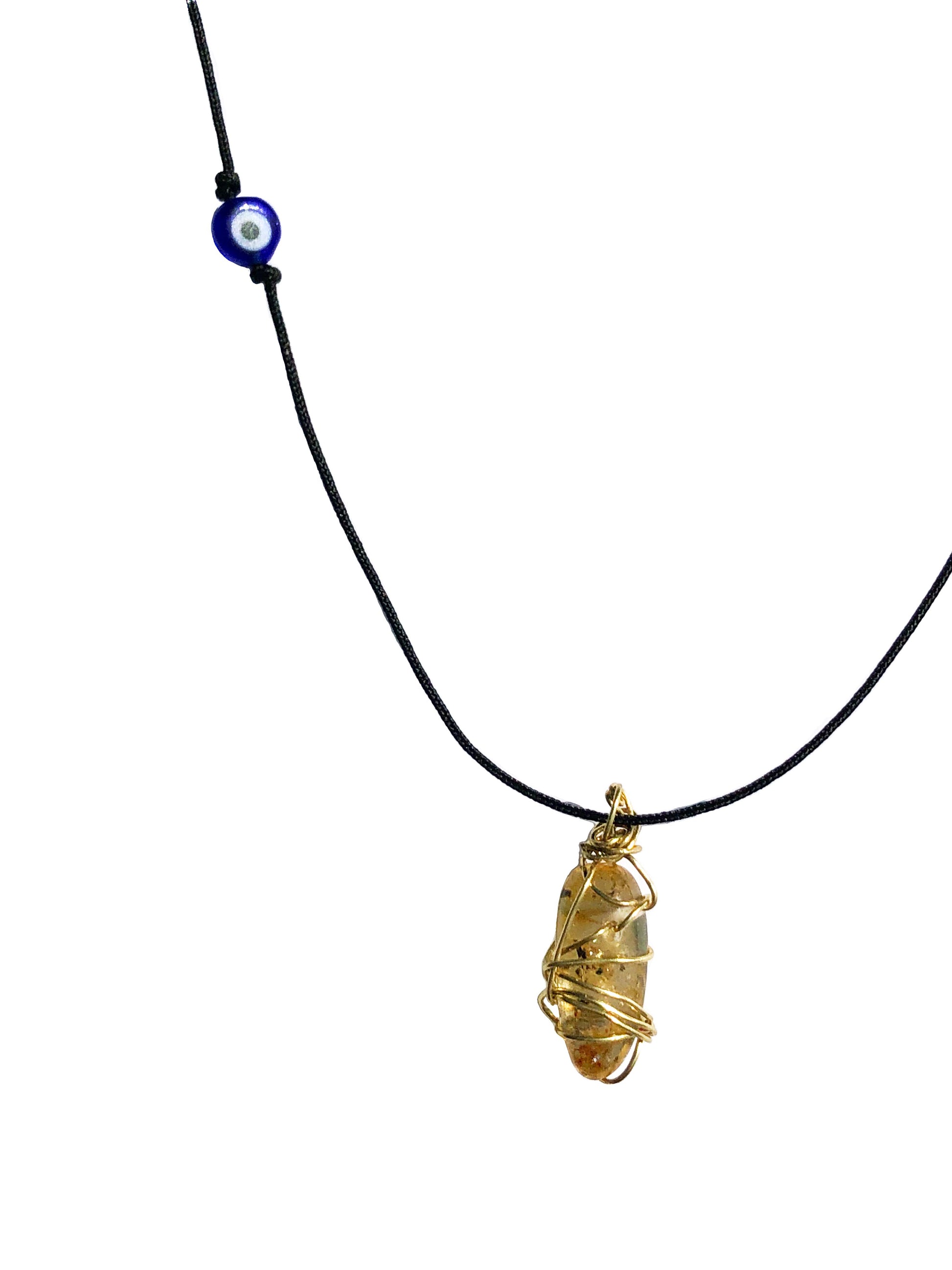 yellow tourmaline golden wire wrapped necklace with evil eye charm.