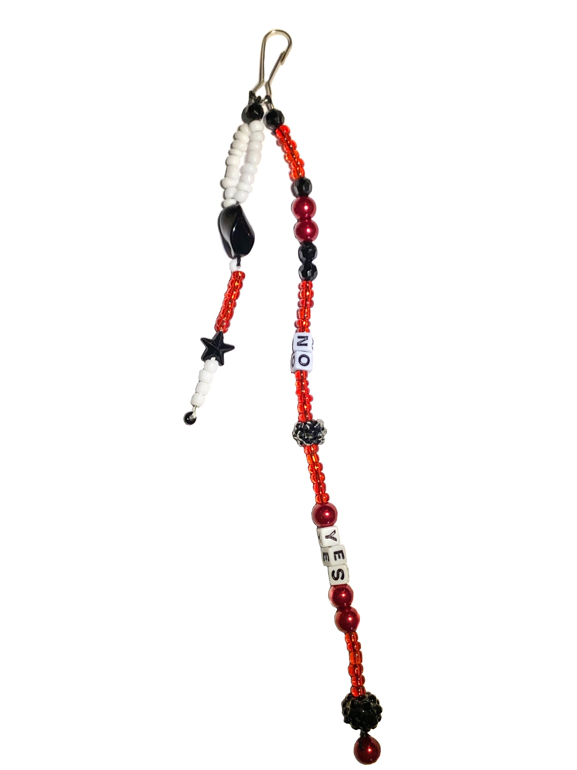 Red, white and black beaded bag charm with black star, stone, and Swarovski ball. Spelled out using letter beads are yes and no.