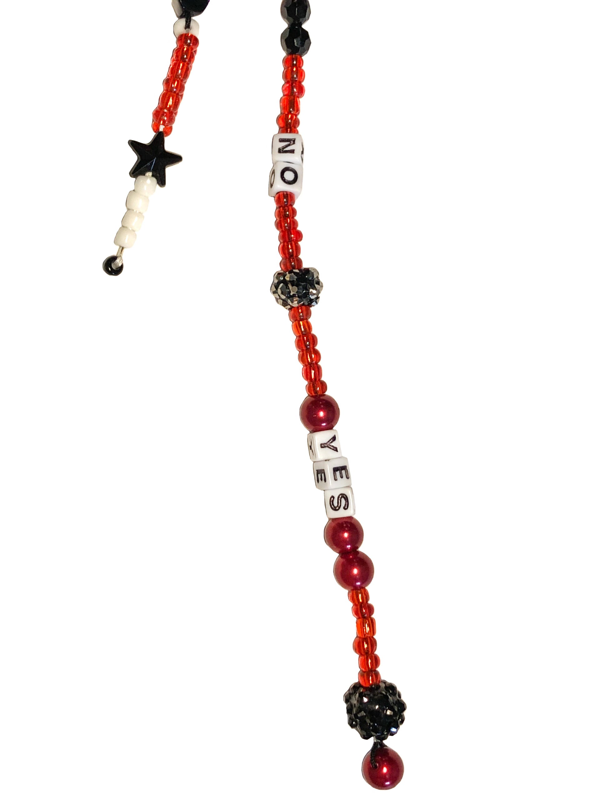 Red, white and black beaded bag charm with black star, stone, and Swarovski ball. Spelled out using letter beads are yes and no.