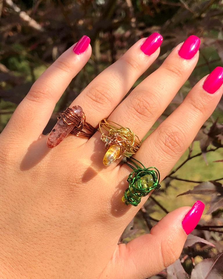 handcrafted wire wrapped ring made using brown wires and a tourmaline gemstone