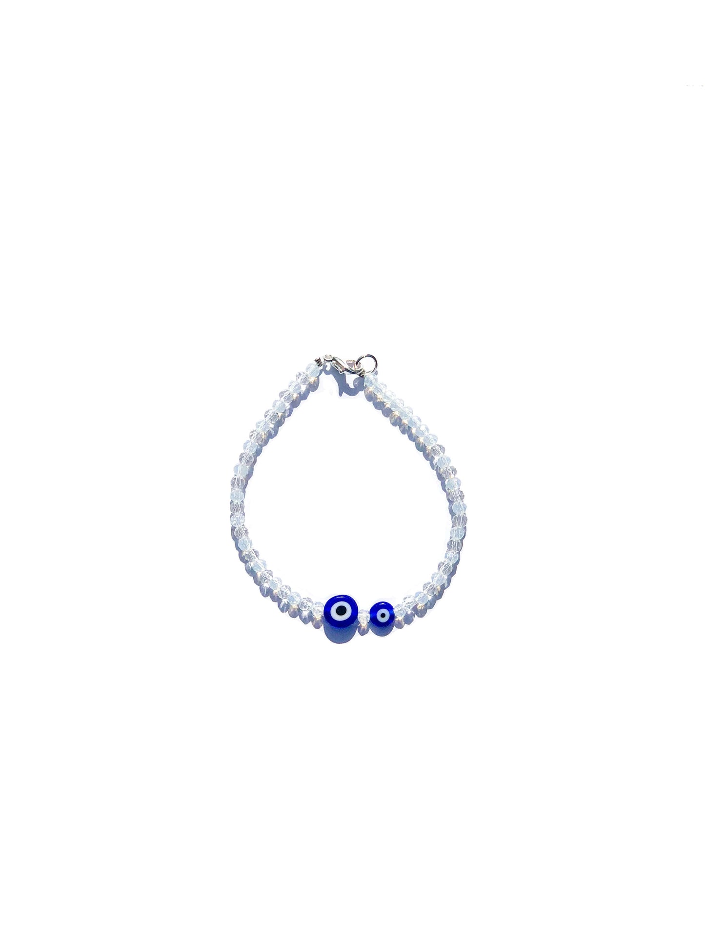 white crystal beads handcrafted bracelet with two blue evil eye charms