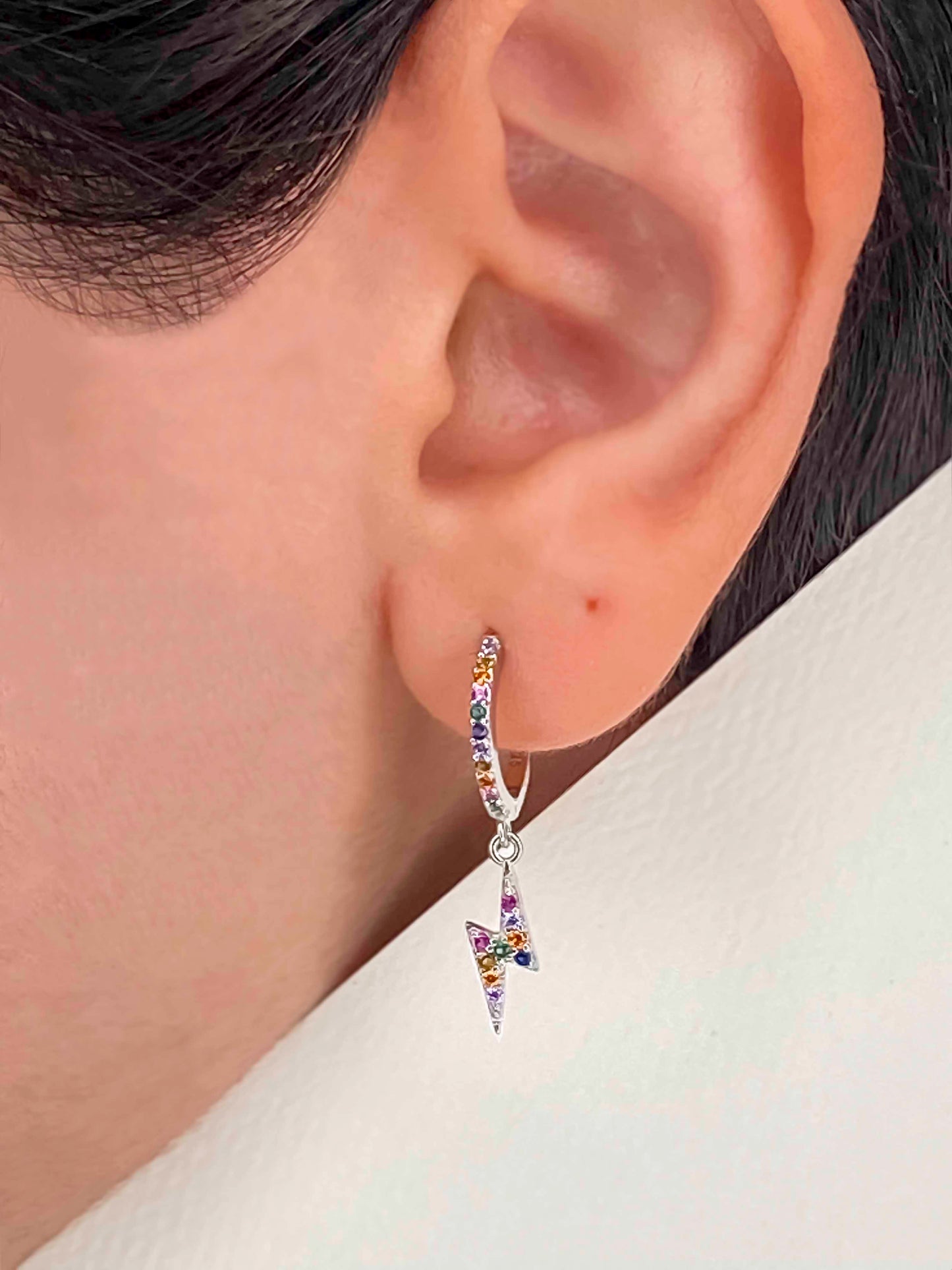 925 sterling silver huggie hoop lighting bolt earrings with multicolored zirconia stones.