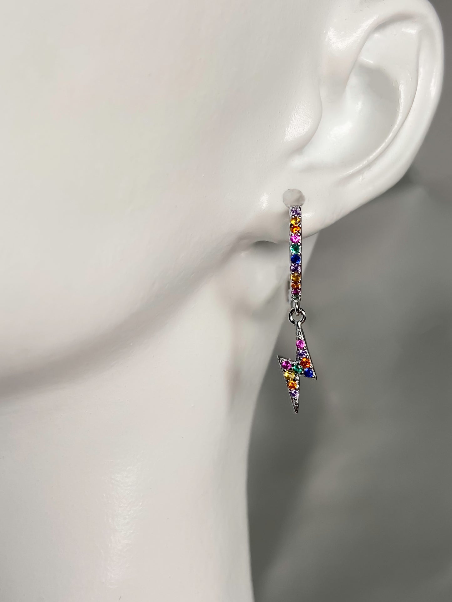 925 sterling silver huggie hoop lighting bolt earrings with multicolored zirconia stones.