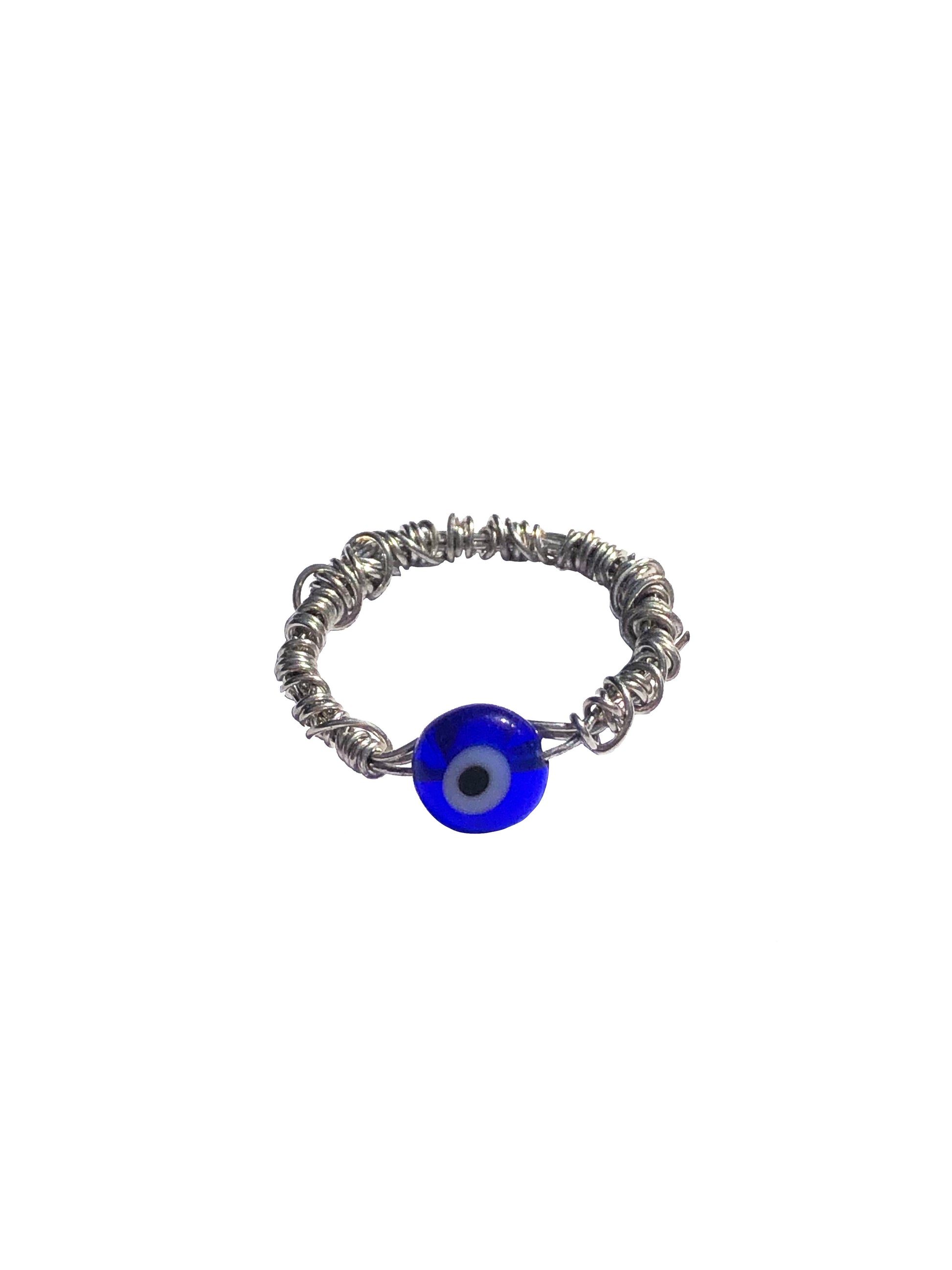 Handmade silver wire wrapped blue evil eye charm ring.