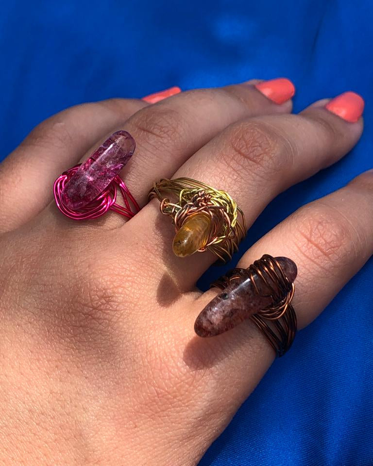 handcrafted wire wrapped ring made using brown wires and a tourmaline gemstone