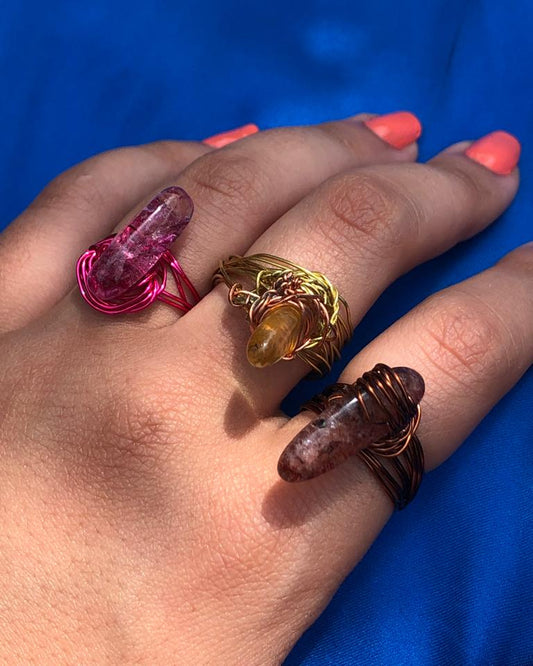 handcrafted wire wrapped ring made using brown wires and a tourmaline gemstone