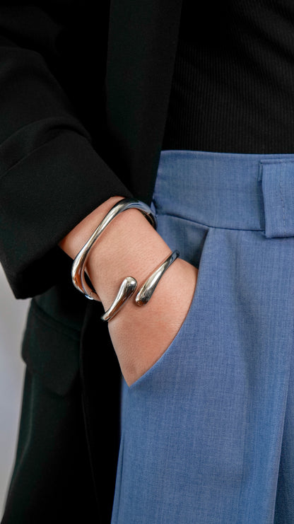 Bangle set featuring open and closed gold or silver bangles