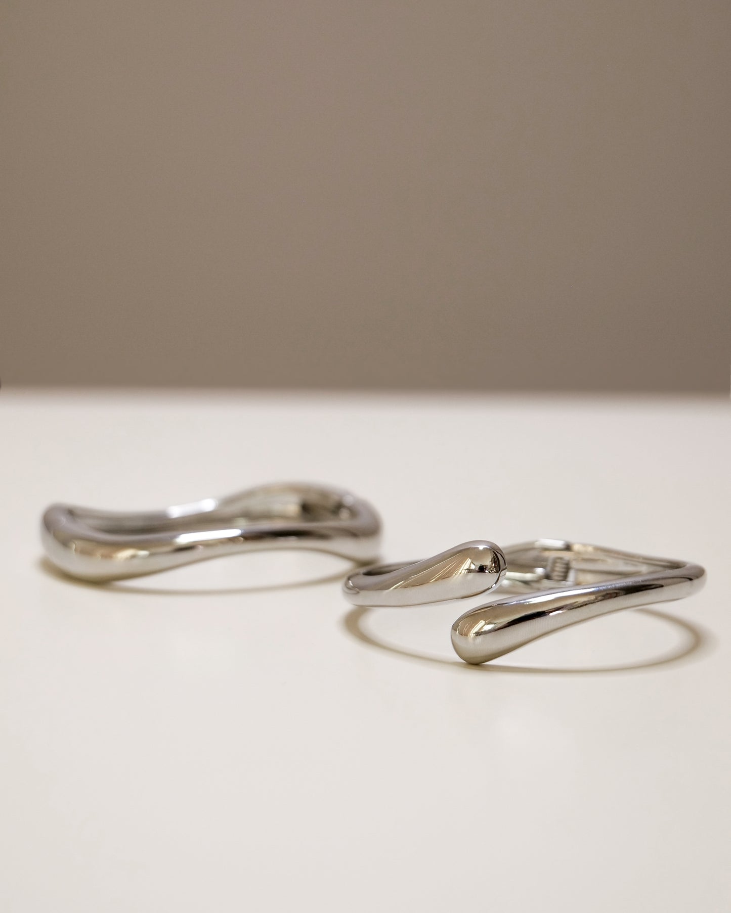 Bangle set featuring open and closed gold or silver bangles