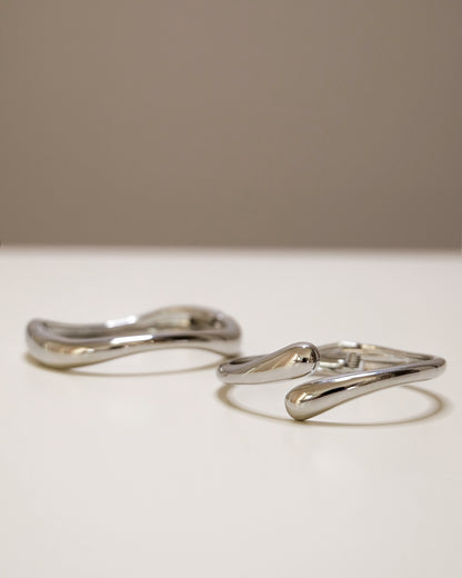 Bangle set featuring open and closed gold or silver bangles