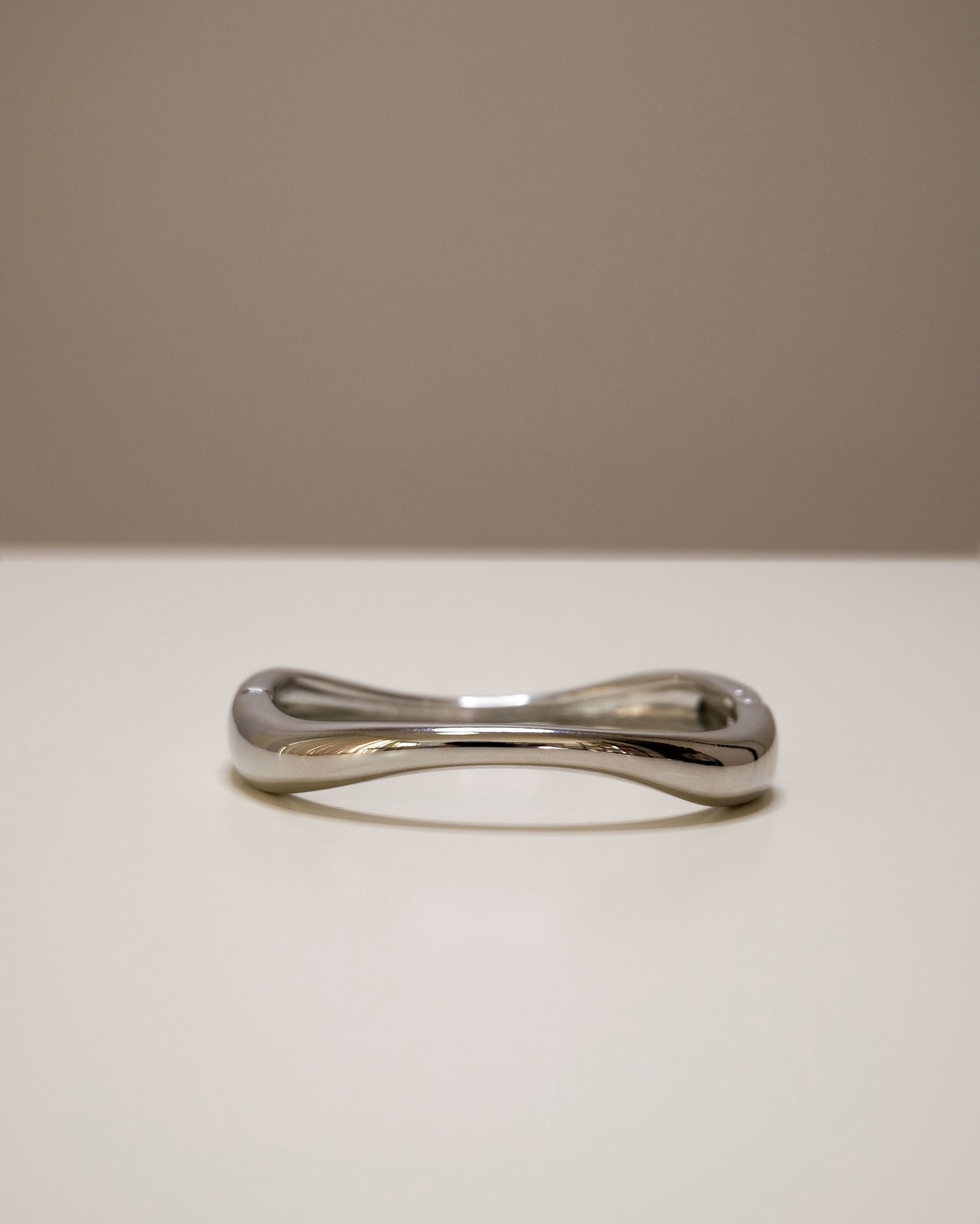 Closed silver bangle, a modern balance of bold and minimal design.