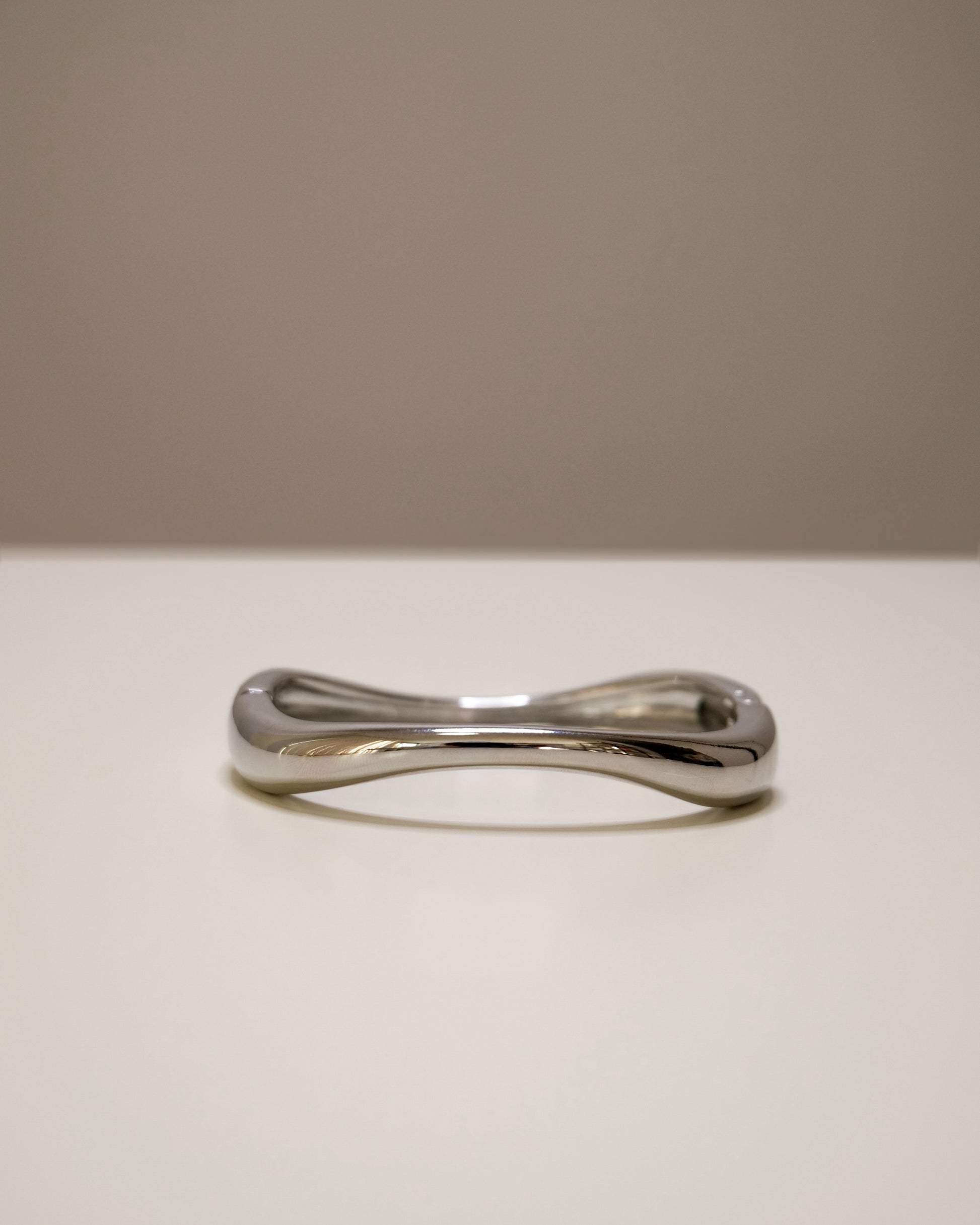 Closed silver bangle, a modern balance of bold and minimal design.