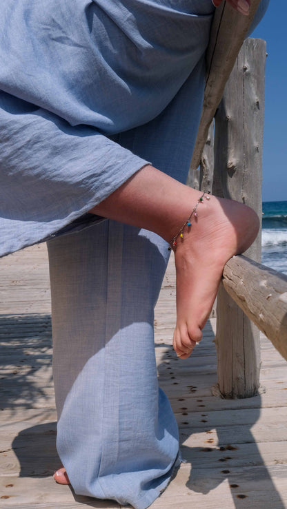 Silver anklet with multicolored star charms, a playful ankle bracelet and silver anklets style inspired by Pandora anklet designs.