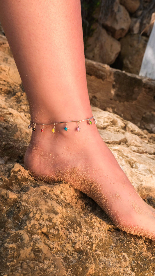 Silver anklet with multicolored star charms, a playful ankle bracelet and silver anklets style inspired by Pandora anklet designs.