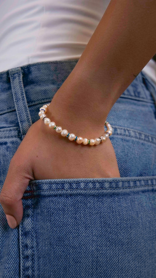 Handmade beaded fresh-water pearl bracelet with rhinestone spacers. 