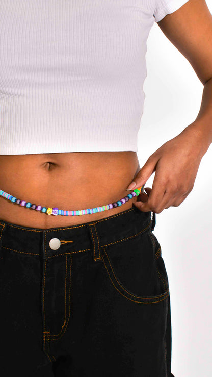 Handmade beaded belly chain made using multicolor flat rubber beads, flower and butterfly charms, and Discoball-like beads.